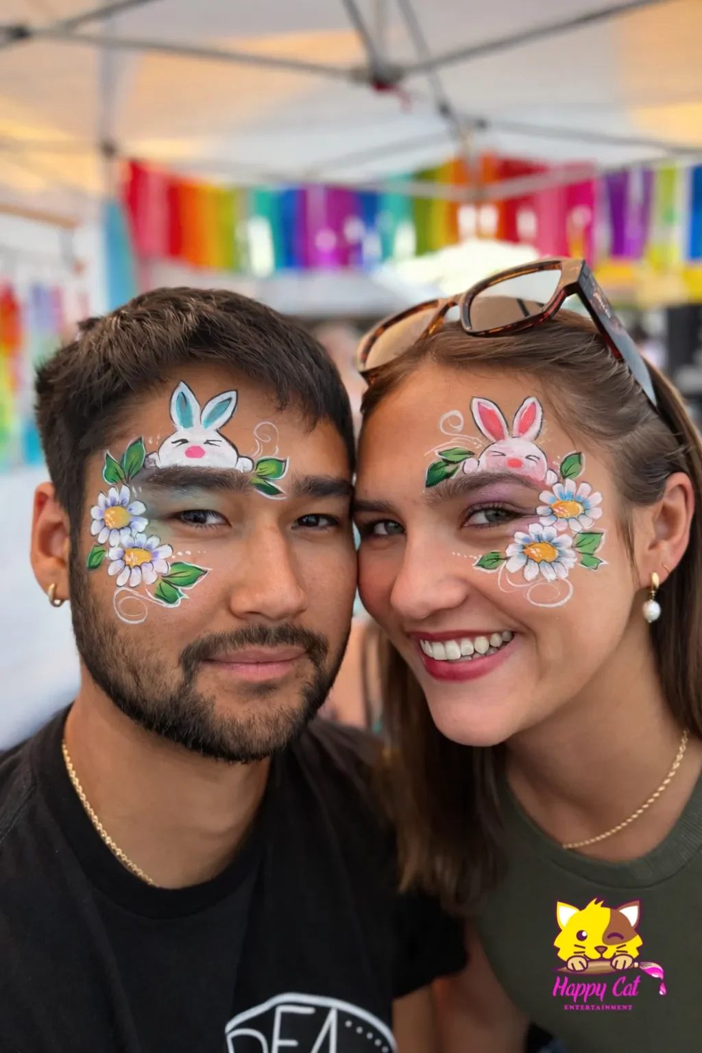 Couple smiling with face painting by Happy Cat Entertainment