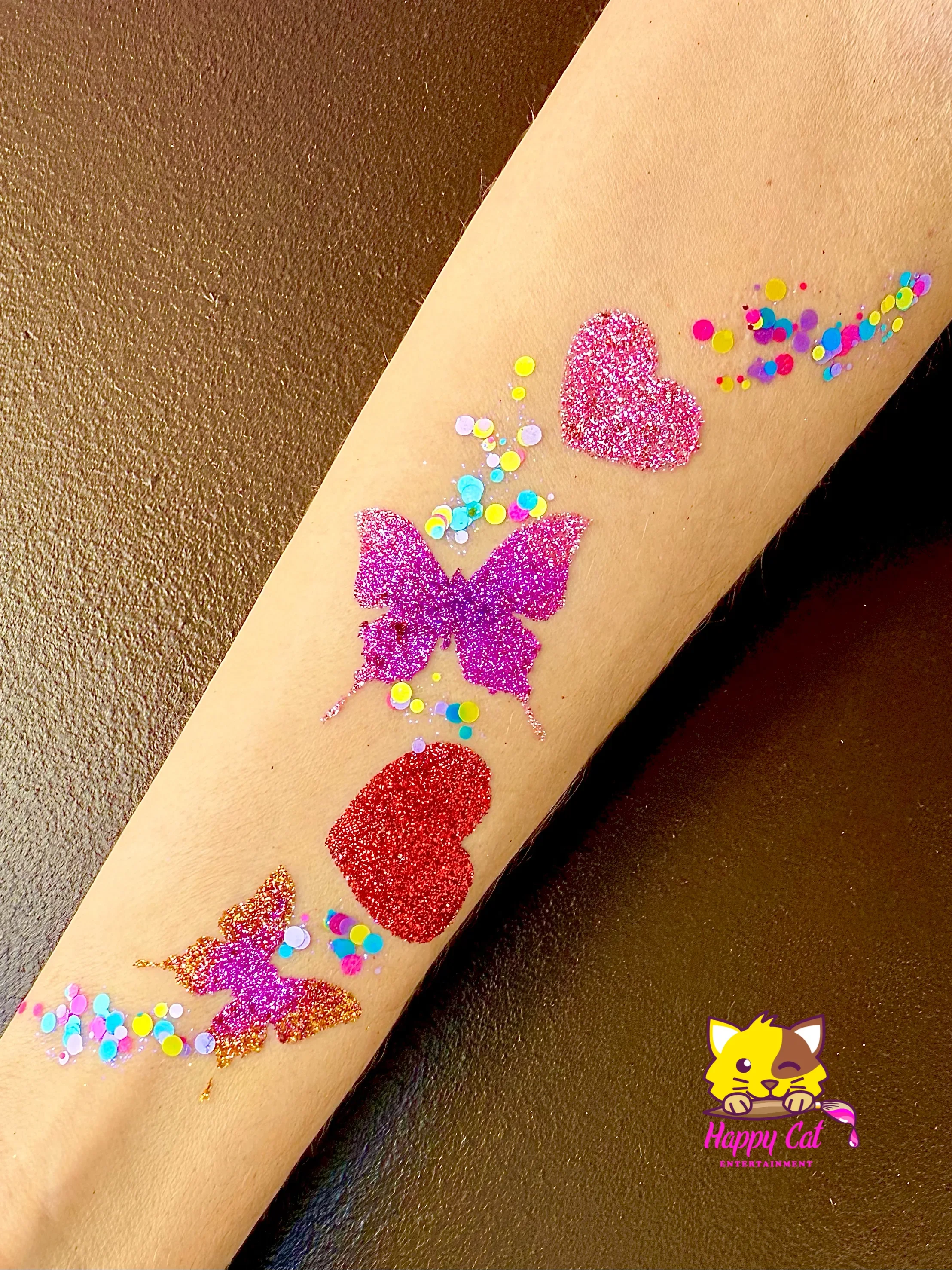 Butterfly and heart glitter tattoo design by Happy Cat Entertainment serving San Diego, CA.