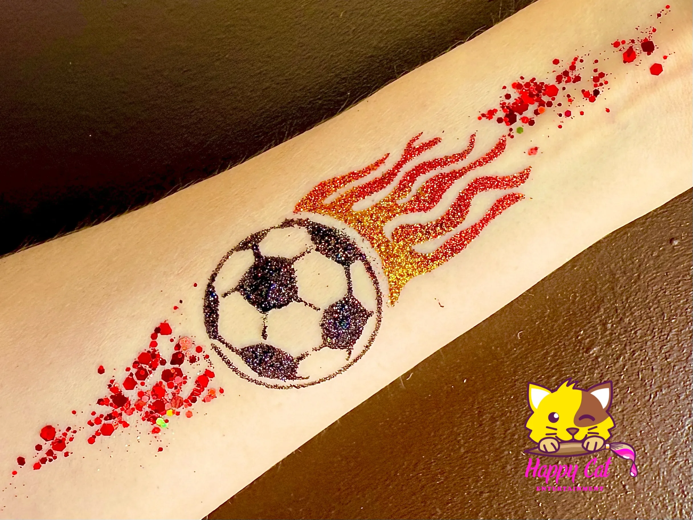 Flaming soccer ball glitter tattoo by Happy Cat Entertainment in Temecula, CA.