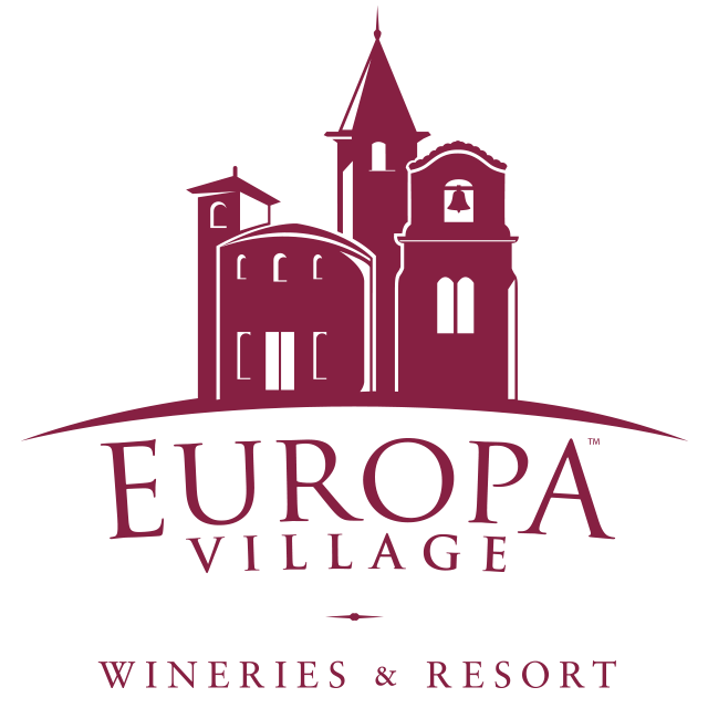 Logo of Europa Village featuring a silhouette of a castle with three towers and the words "Europa Village" and "Wineries & Resort" beneath it.
