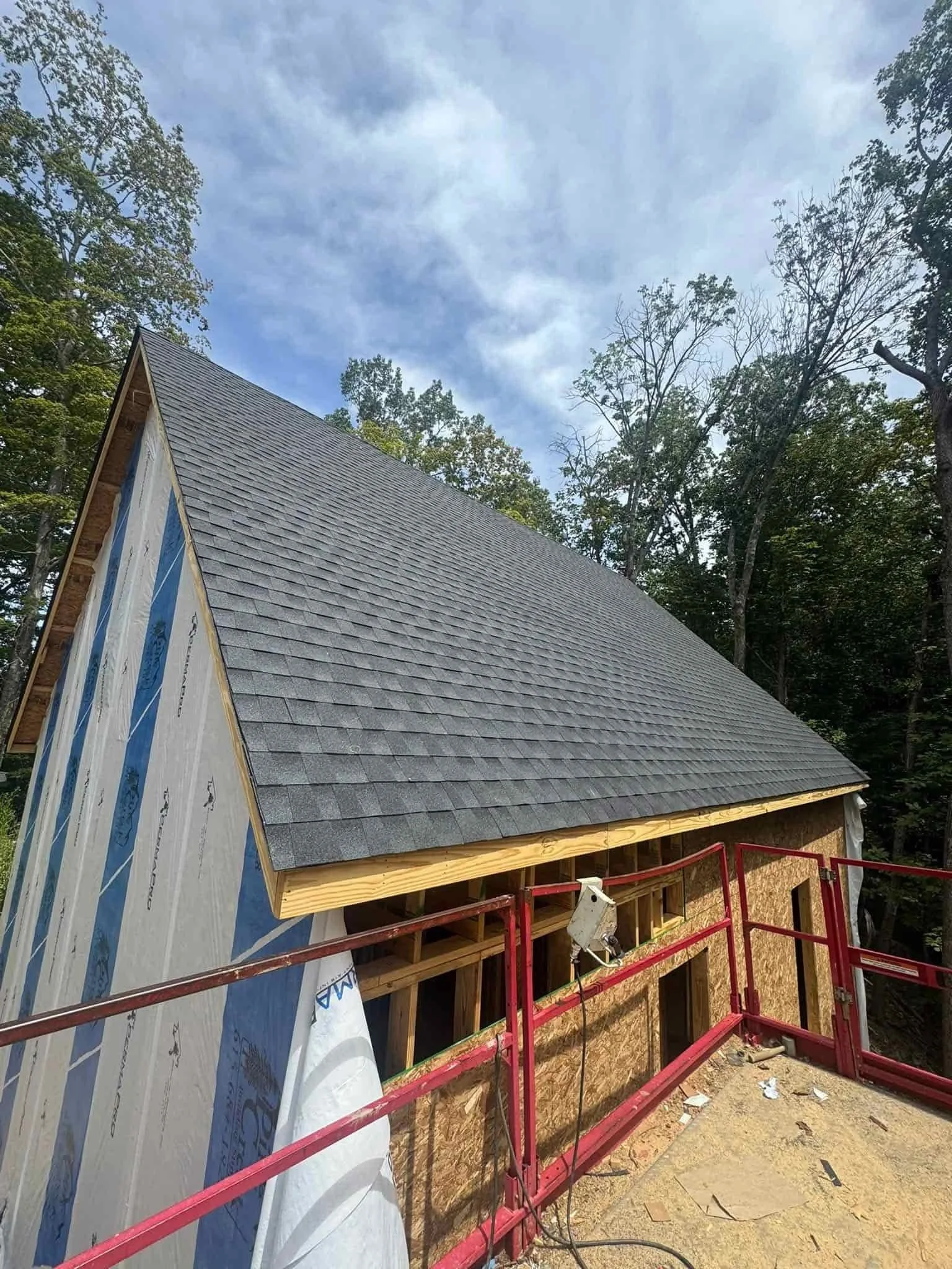 close up of damaged shingles being repaired on residential roof in Middle Tennessee