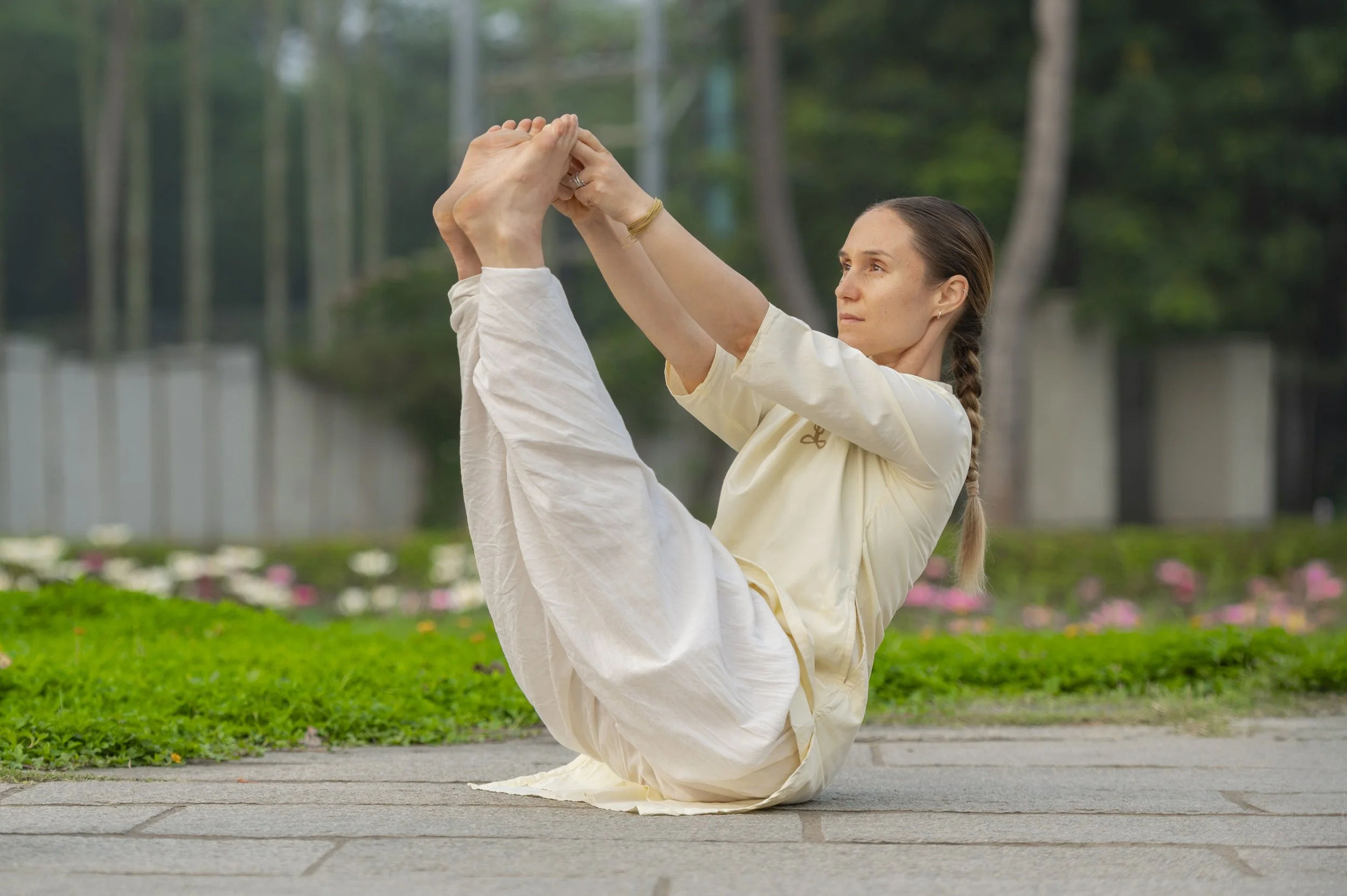 Young girl practising angamardana a core classical hatha yoga practise in Melbourne