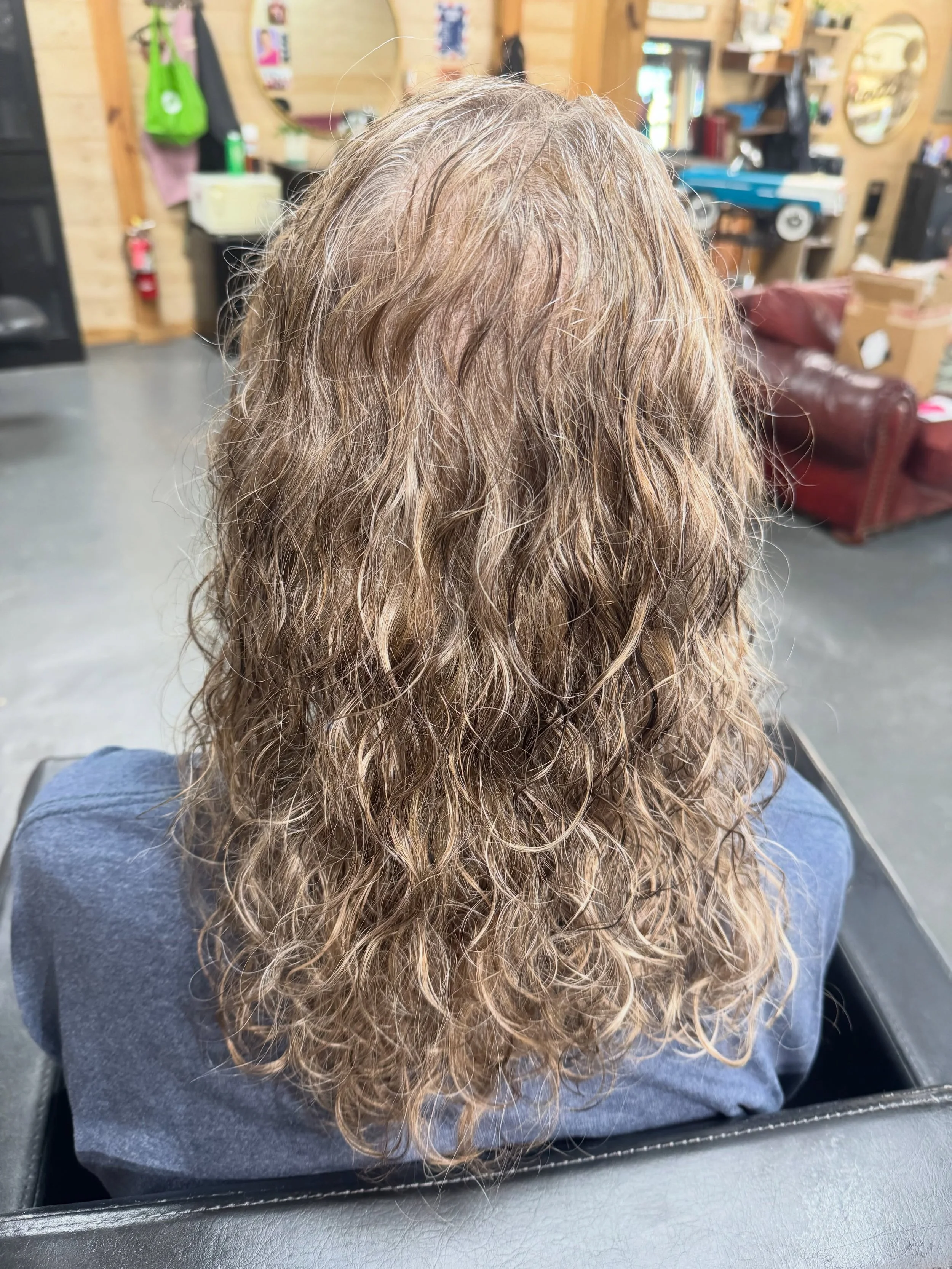Ready to embrace your grey in a way that makes your hair growth look blended and natural?! Let's get on the books! 

Today's client wanted to remove a little bit of length and add some layers to help her natural curls regain shape, lowlight in some m