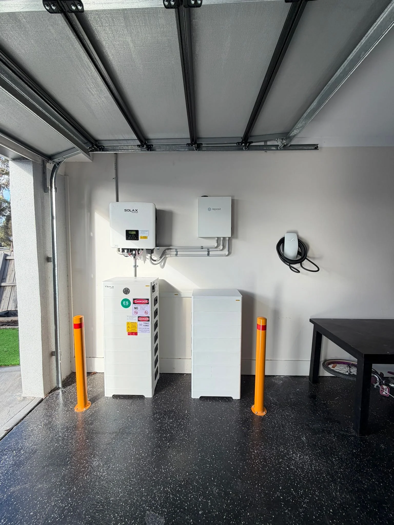 Tesla Wall Connector installed in Hoppers Crossing garage with solar battery system