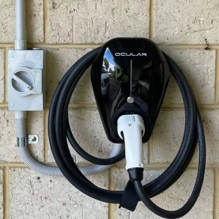 Ocular IQ Home Solar EV charger installed on wall with Type 2 charging cable