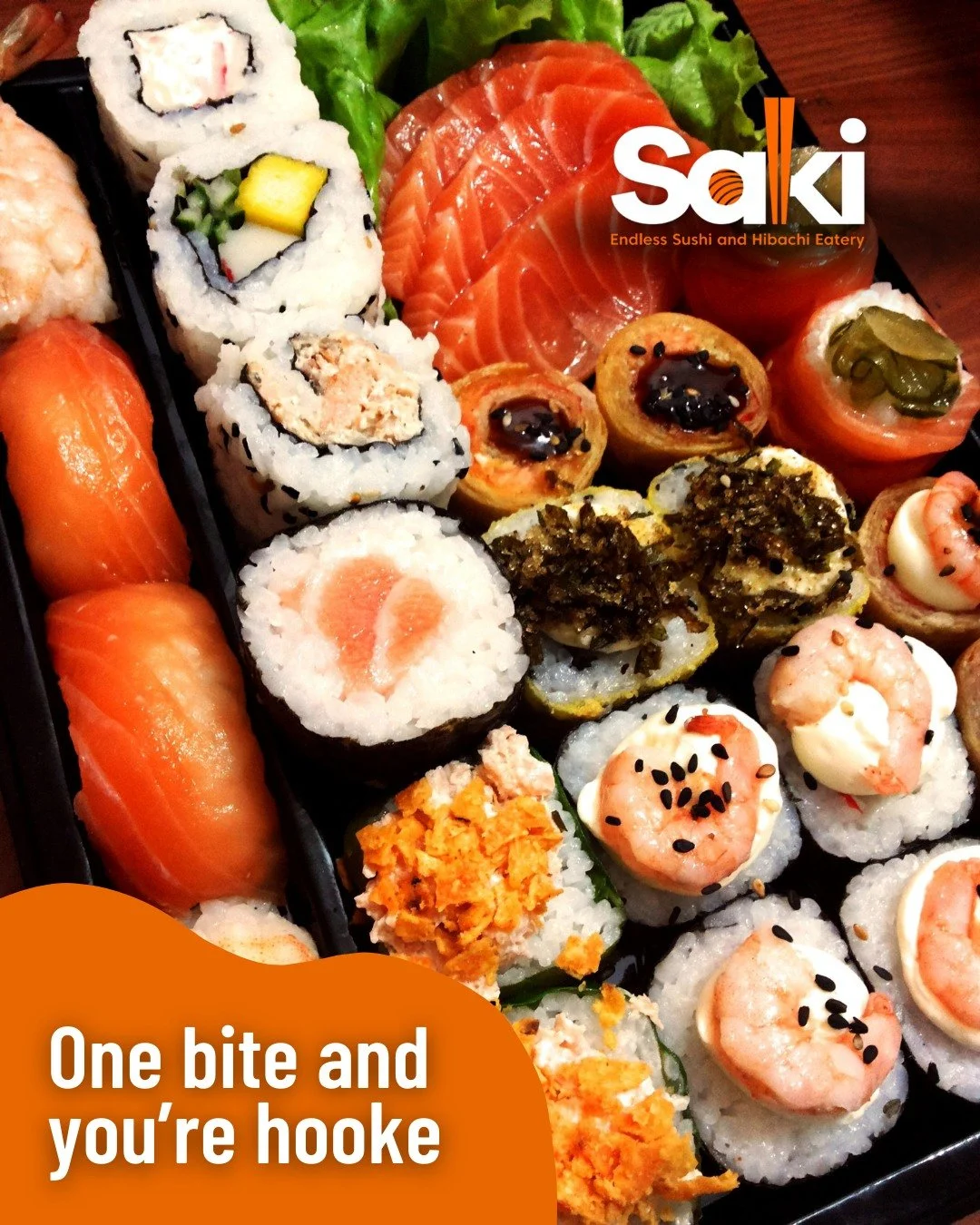 Assorted sushi rolls with salmon, shrimp, seaweed, and various toppings, in a black sushi tray.