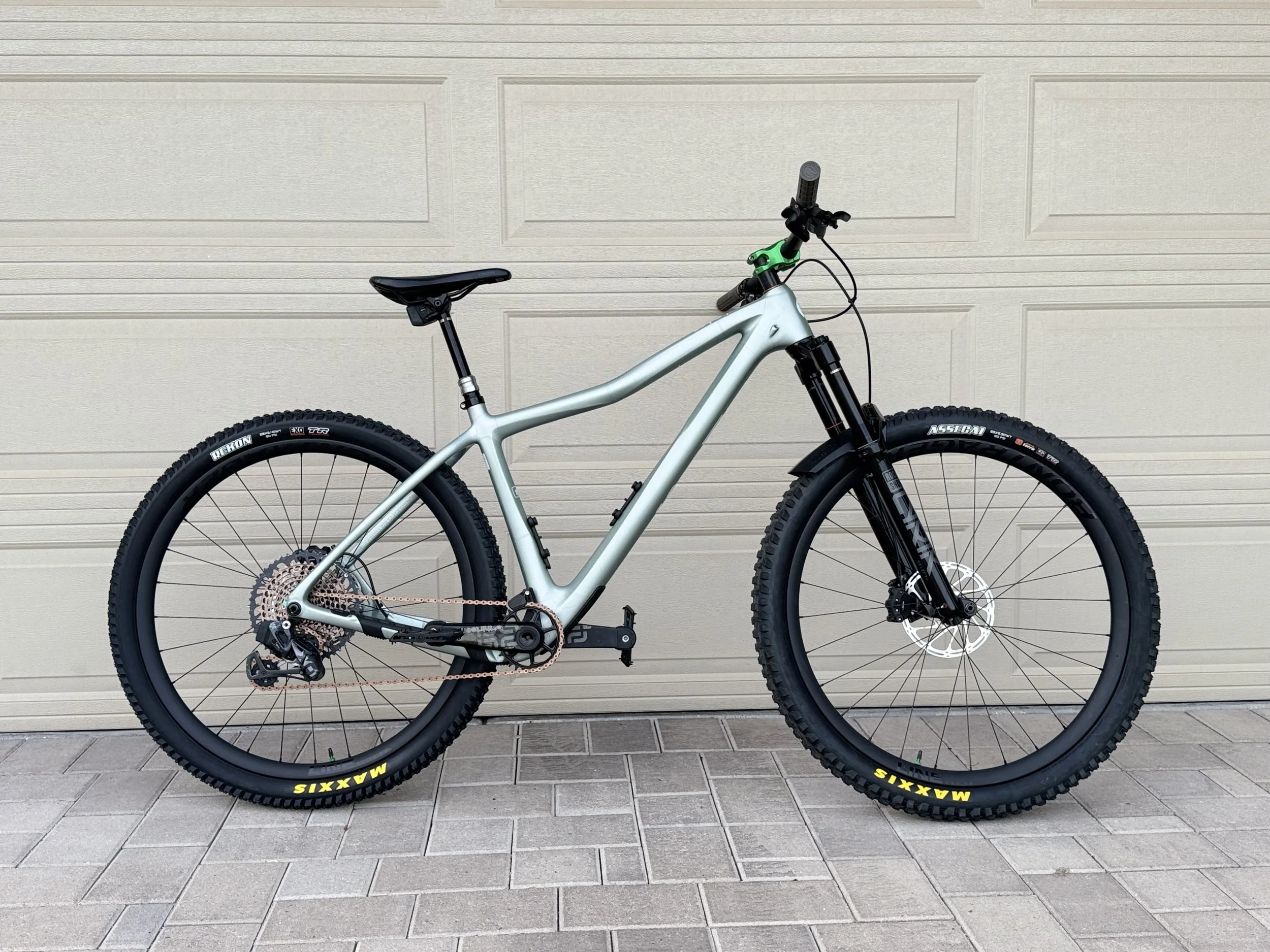 Sign with text 'Commission in Process' and a logo of a bicycle inside a gear, with the words 'Rideventure Bespoke MTB Lab'.