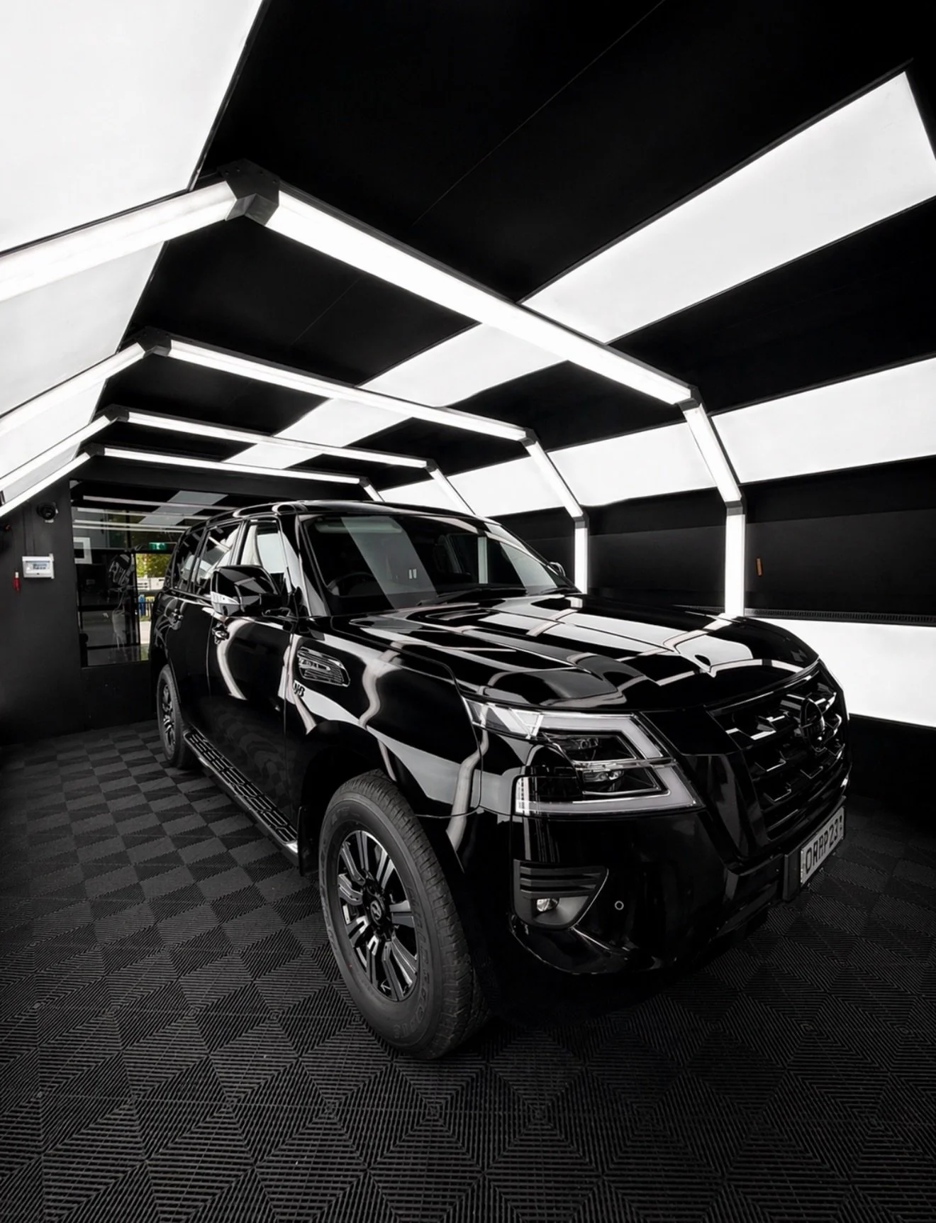Blacked out Patrol looking pretty coated with our 5 year ceramic coating. Call us now for black packed and protection packages.