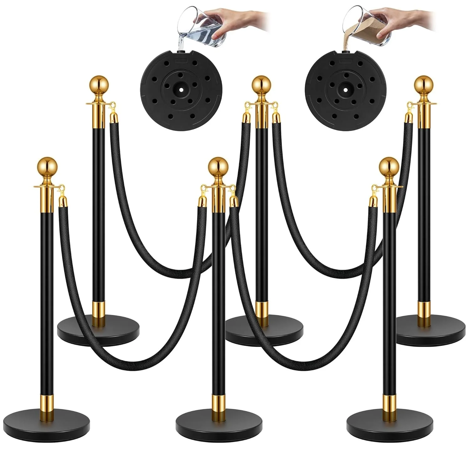 A decorative stanchion barrier with black posts, gold accents, and black ropes, with someone pouring water into a black base.