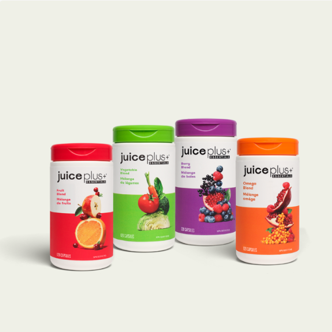 Four bottles of Juice Plus+ dietary supplements with different flavor labels and colorful caps, arranged on a white background.