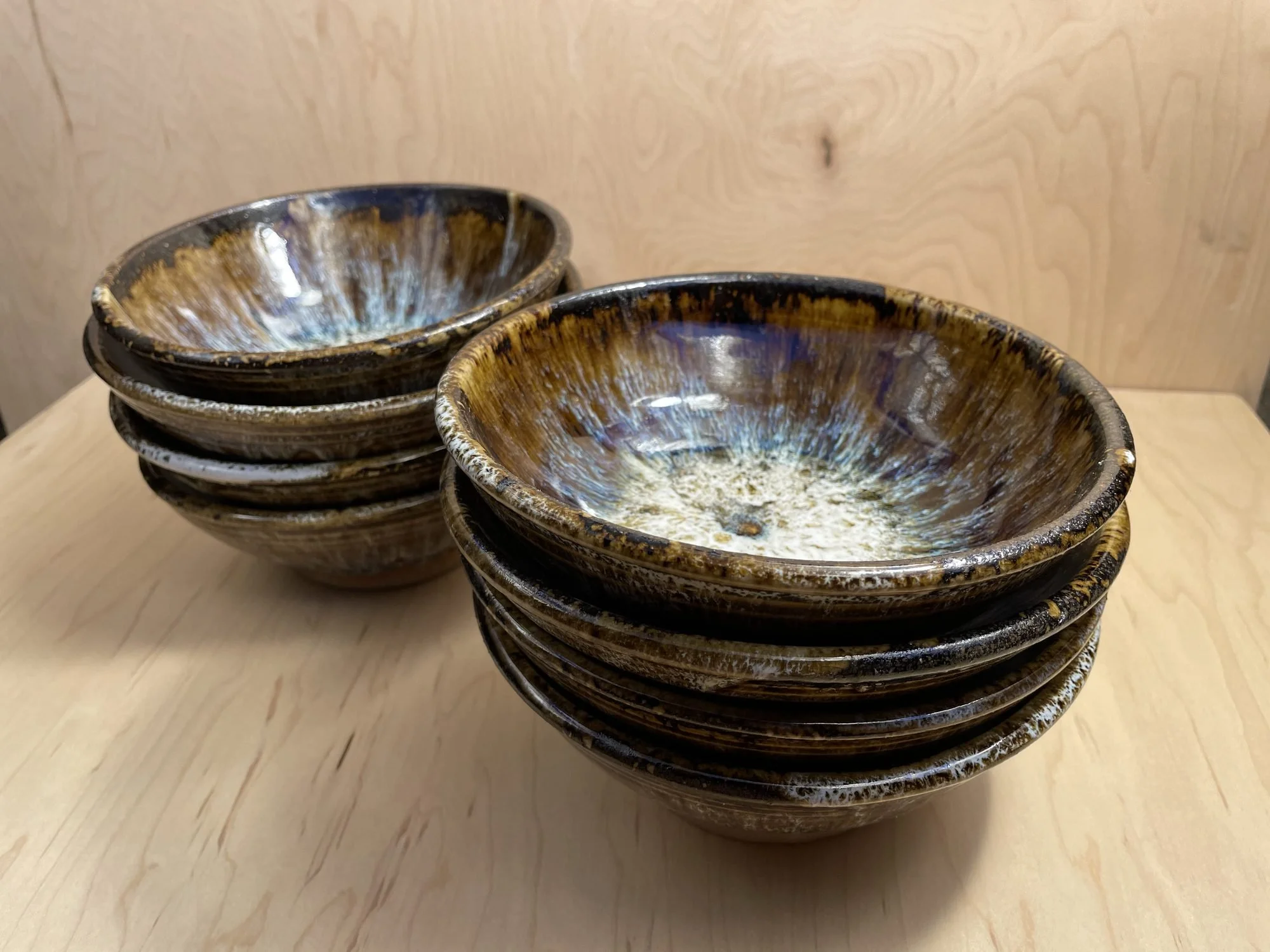 Stacked bowls showing white centers fading out to brown and blue rims