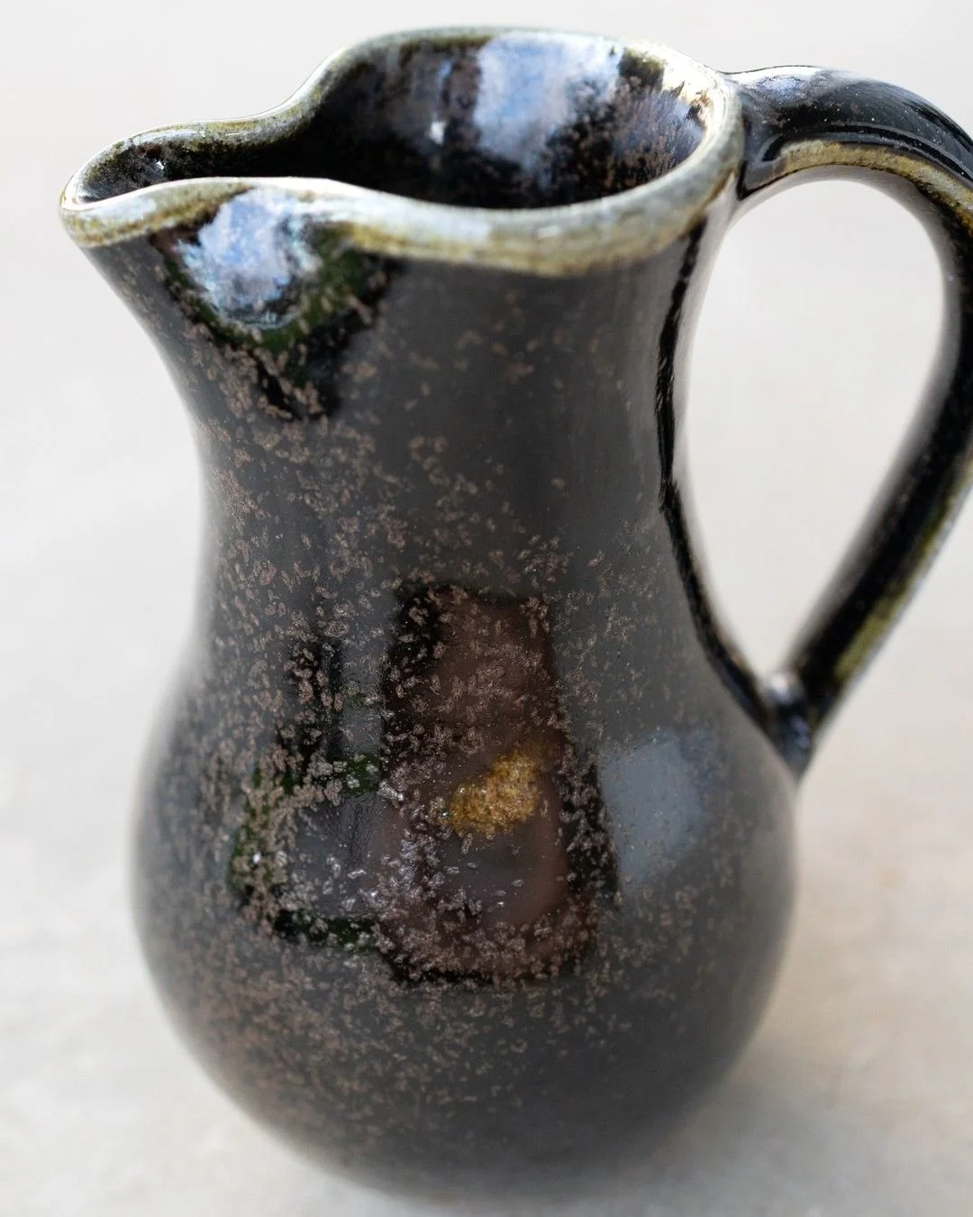 Not everything I fire gets listed. These did.

A pitcher, a few bowls, a small dish, and some cups, all high fired. That phrase matters more than it sounds. High fire means the clay itself has gone dense and nearly glass-like, so it doesn't soak up w