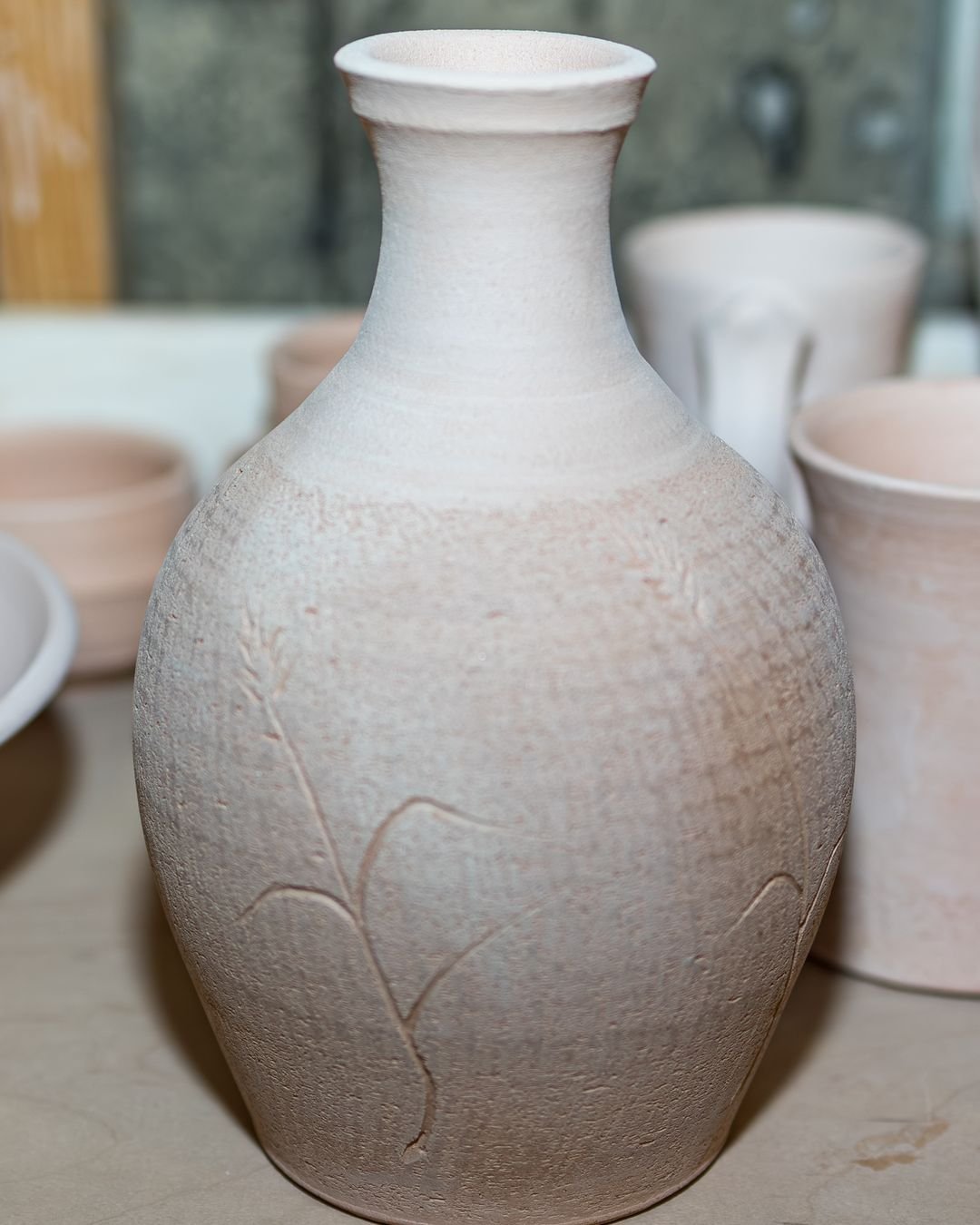 This is bisque, the in-between stage. Pots get fired once at a low temperature so they're hard enough to handle and porous enough to soak up glaze, then fired again, hotter, with the glaze on.
#PotteryProcess #UtahPottery #CeramicArtist #CorbridgePot