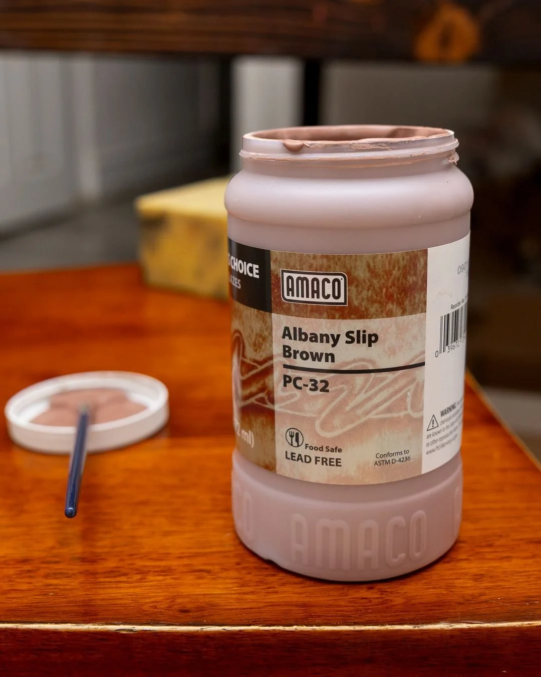 Albany Slip Brown is named after a clay that was dug out of the ground near Albany, New York.

For more than a century, potters used that clay by itself as a glaze. At high temperature it melts on its own into a glossy dark brown, which is why so man