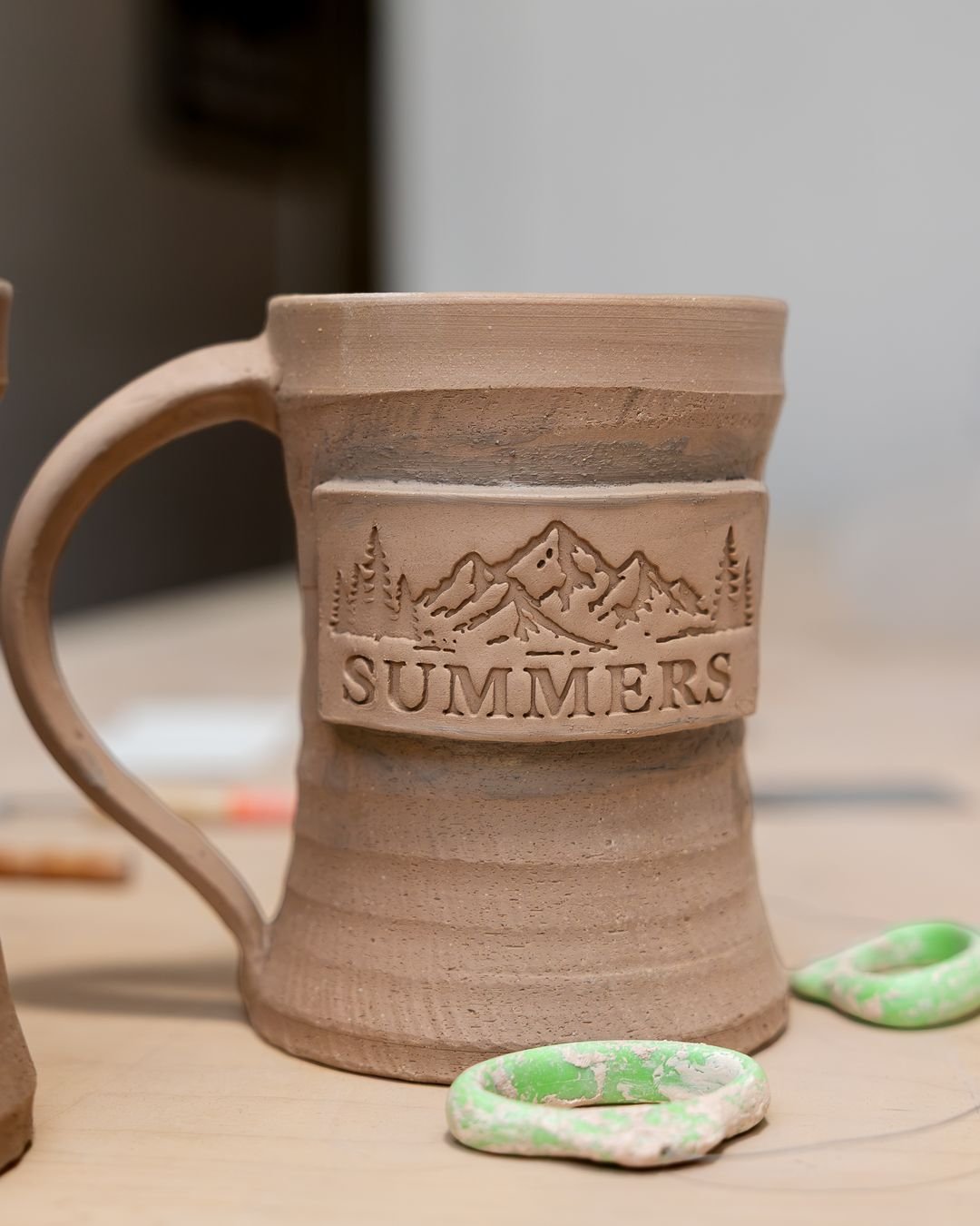 This is the most fragile this mug will ever be.

Unfired clay is called greenware, and it's really just dried mud holding a shape. Knock the rim and it chips. Pick it up by the handle and the handle can snap off. Get it wet and it starts turning back