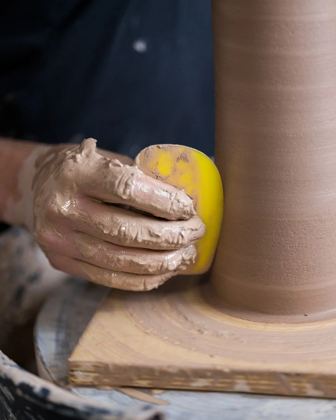 Throwing days are not clean days. This is about as tidy as my hands get by the time a pot is this tall.

All that slick stuff is slurry, basically clay and water that works loose while I'm pulling the walls up. It's fine on my hands, but on the pot i