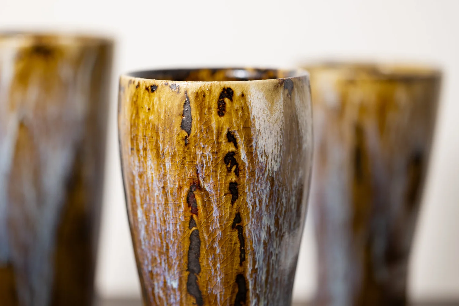 Close-up of glaze on tall cups