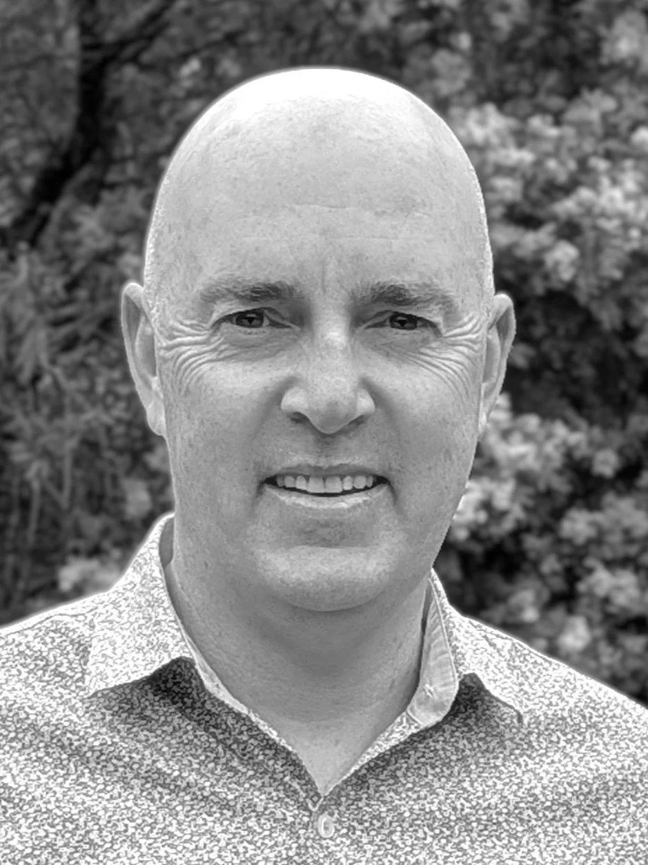 Black and white photo of Drew Matthews, a professional engineer and senior road safety auditor.