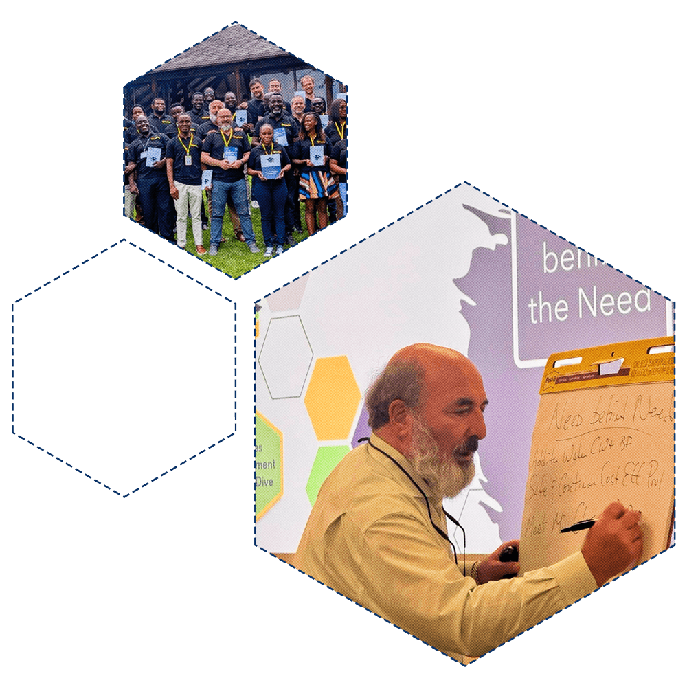 Bob Hultz with a B2B sales team in Africa holding VSI books and teaching the VSI frameworks