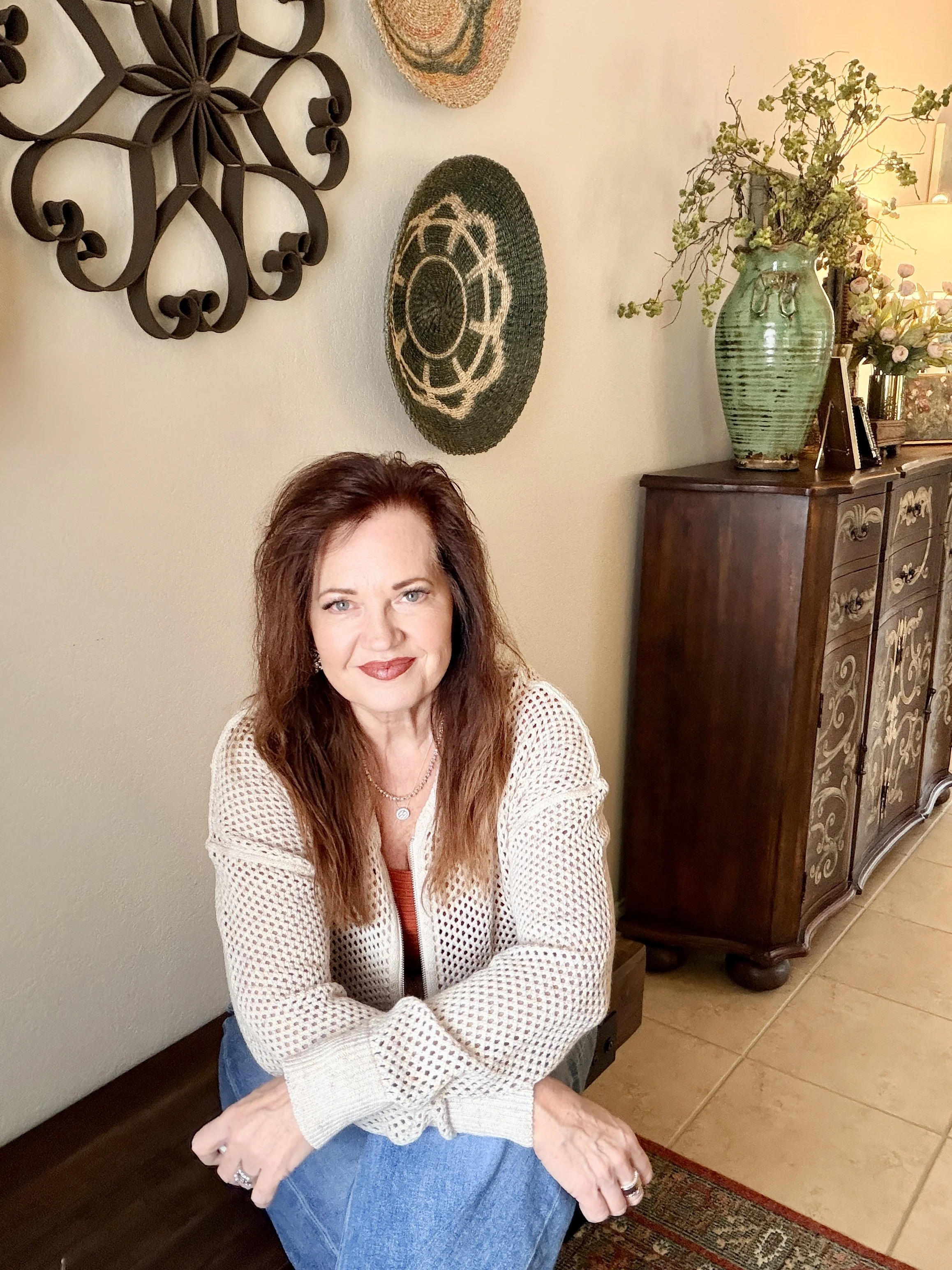 Candace seated indoors founder seated in a warm interior setting, representing curated living and slower living.