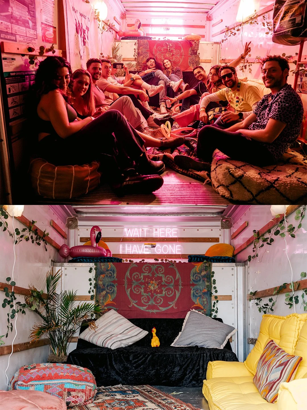 Colorful indoor room with pink lighting, a group of nine friends sitting on cushions and rugs, smiling and making peace signs, with decorative elements like flamingo inflatables, plants, and neon signs reading "WAIT HERE GONE"