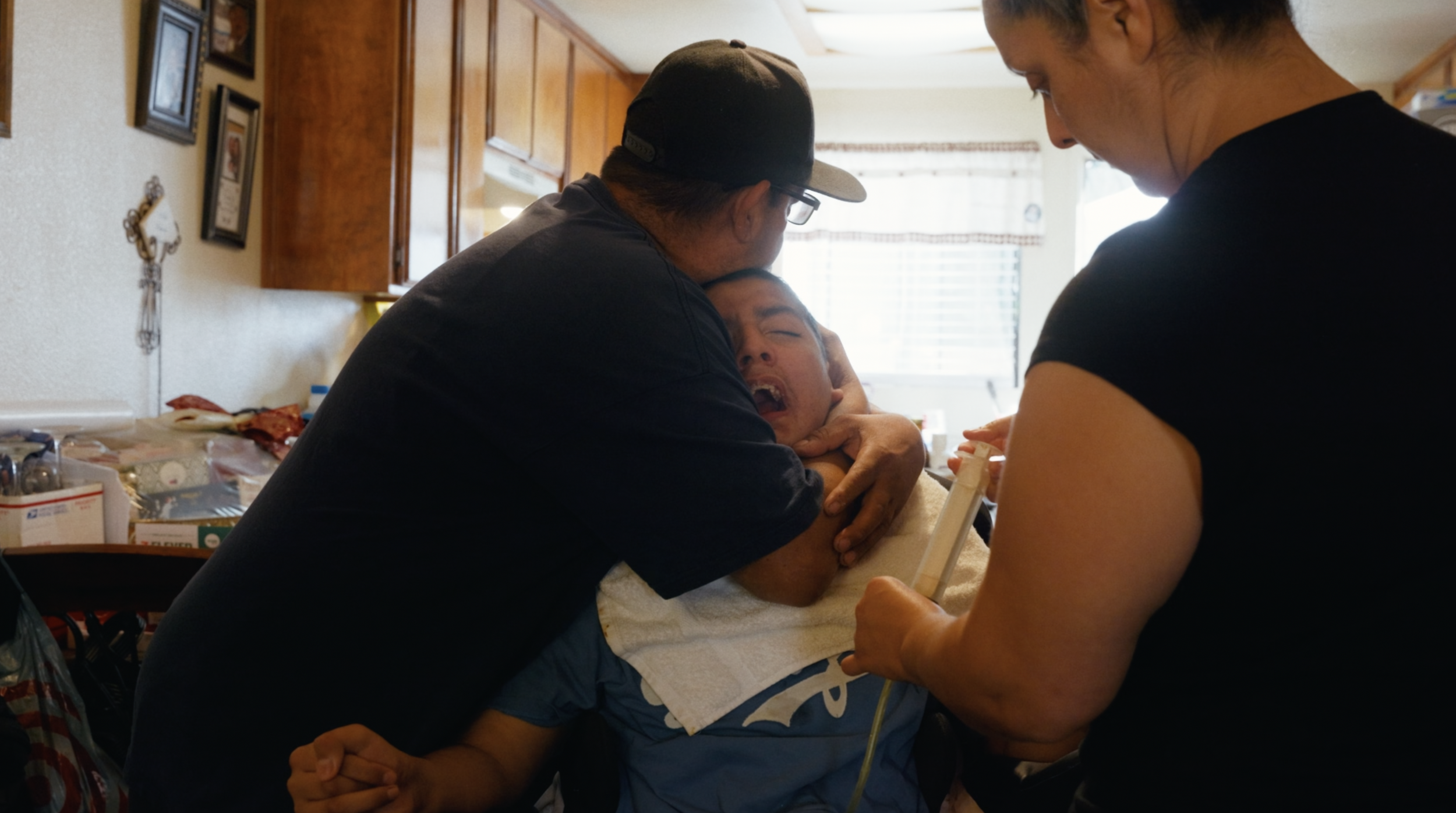 Tender care for a child recovering from a drowning related brain injury - Film production still from brand film directed by Jhovany Quiroz Studio