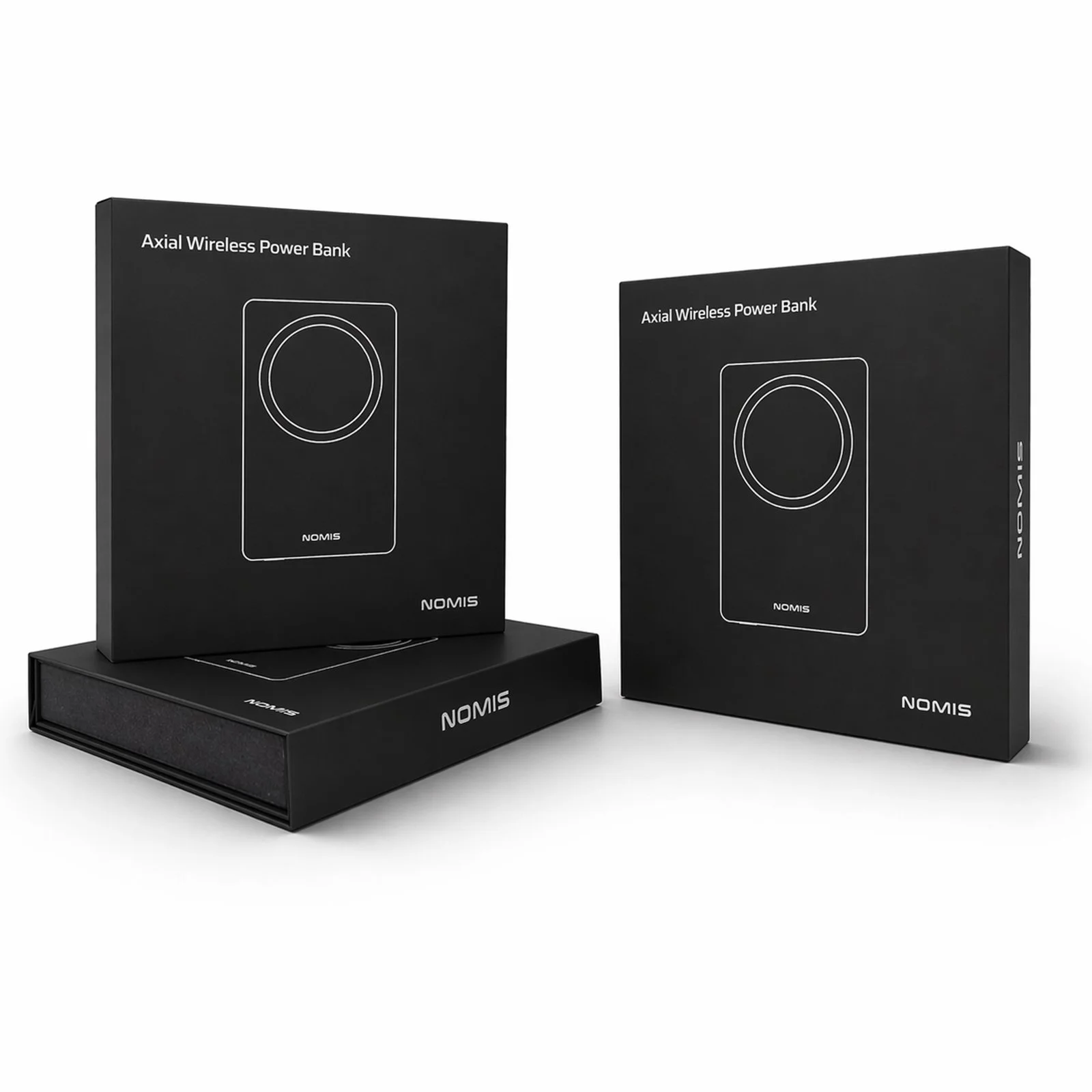 Two black boxes labeled 'Axial Wireless Power Bank' with a line drawing of a power bank, and a black rectangular box with 'NOMIS' written in white, all placed on a flat surface.