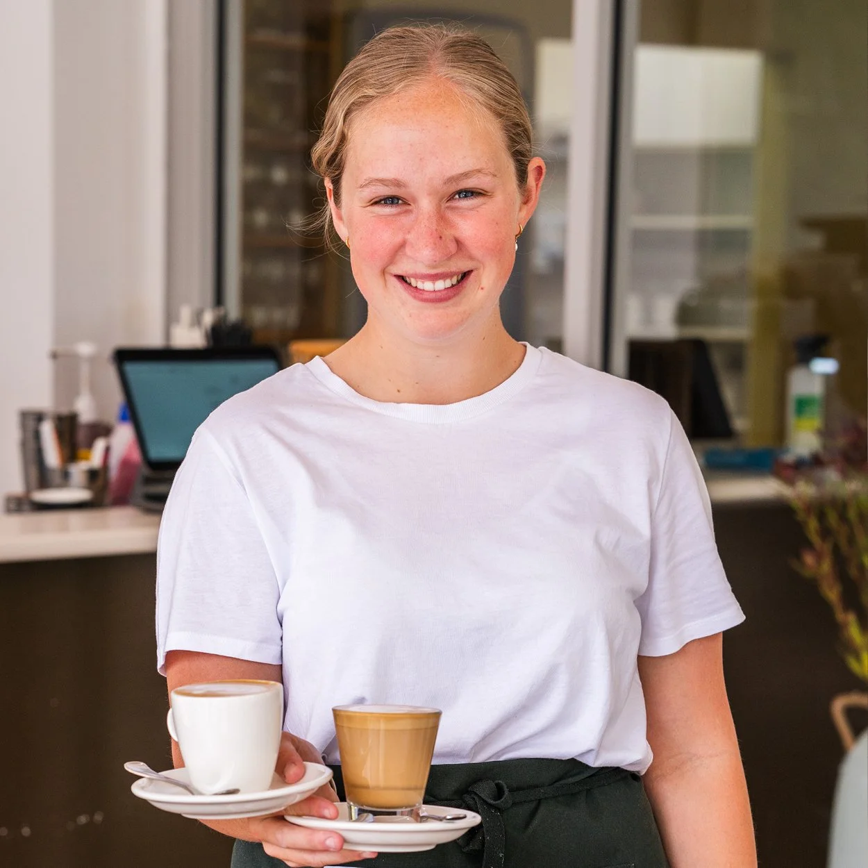 Happy Spoons Riverside staff member delivery coffee
