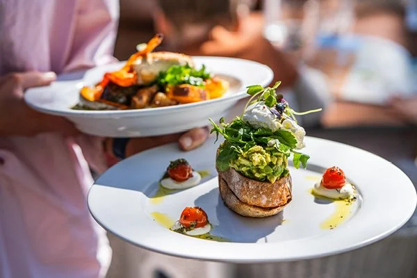Spoons Riverside delicious meals. In front avocado on toast with roasted tomato