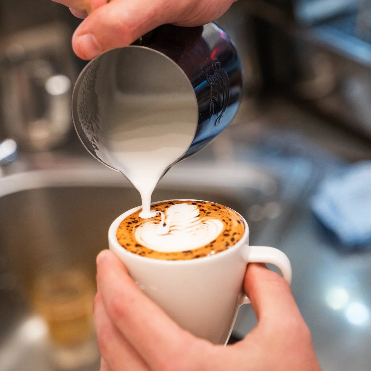 Spoons Riverside coffee being poured