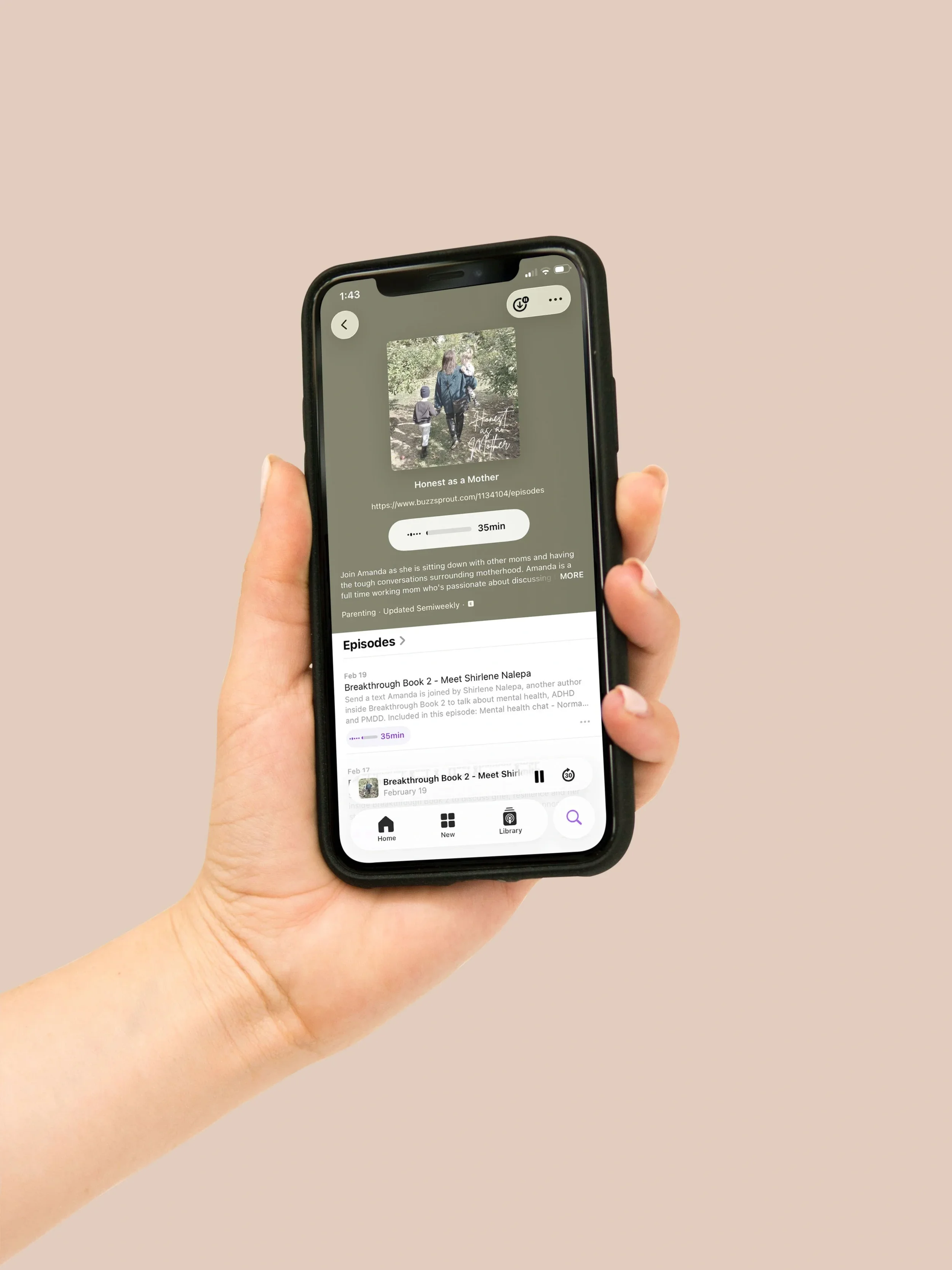A hand holding an iPhone displaying the Honest As A Mother Podcast