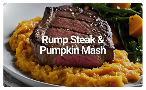 Rump steak with pumpkin mash served with a side salad of greens and diced vegetables.