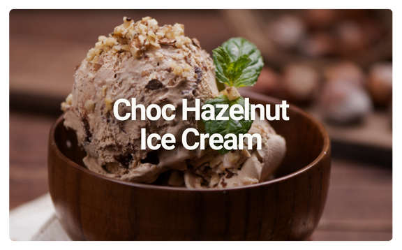 Scoops of chocolate hazelnut ice cream topped with crushed nuts in a wooden bowl, garnished with a mint leaf.