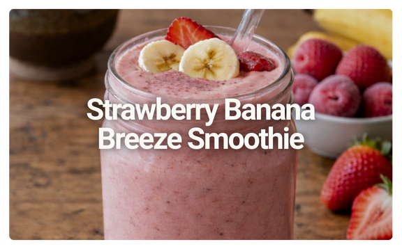 A glass of strawberry banana breeze smoothie garnished with banana slices and strawberries, with additional strawberries and bananas in the background.