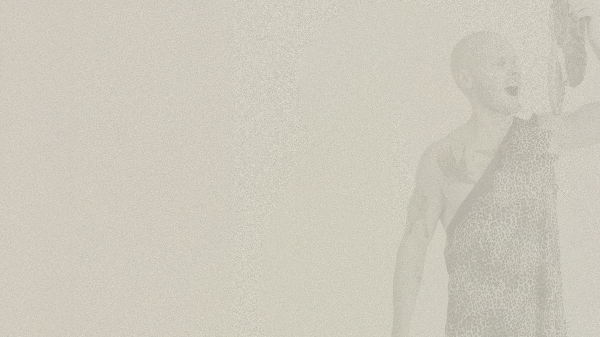 Beige grainy banner with an overlay of Lachy Oliver In a caveman outfit eating a steak