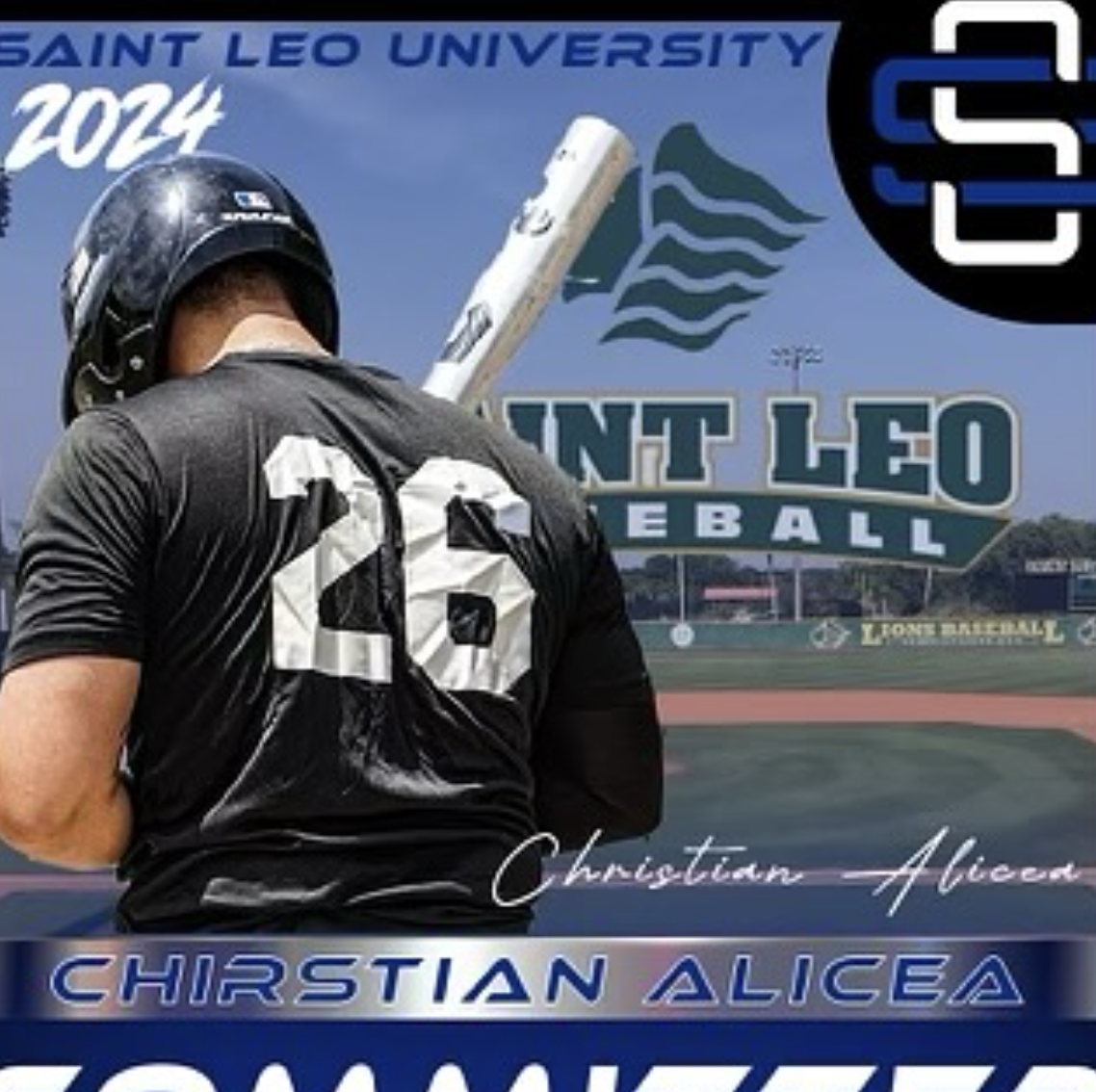 A baseball player wearing a black uniform with the number 23, a black helmet, and holding a bat, standing in front of a sports field with a large sign for Saint Leo University Baseball.