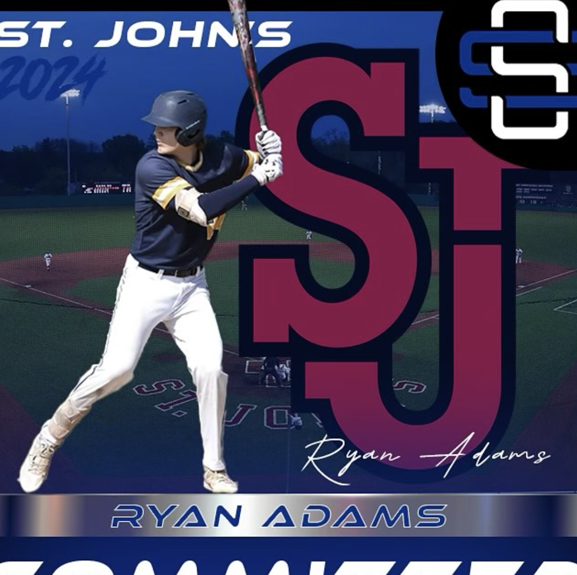 A baseball player in a navy uniform and helmet preparing to swing a bat on a baseball field at dusk.