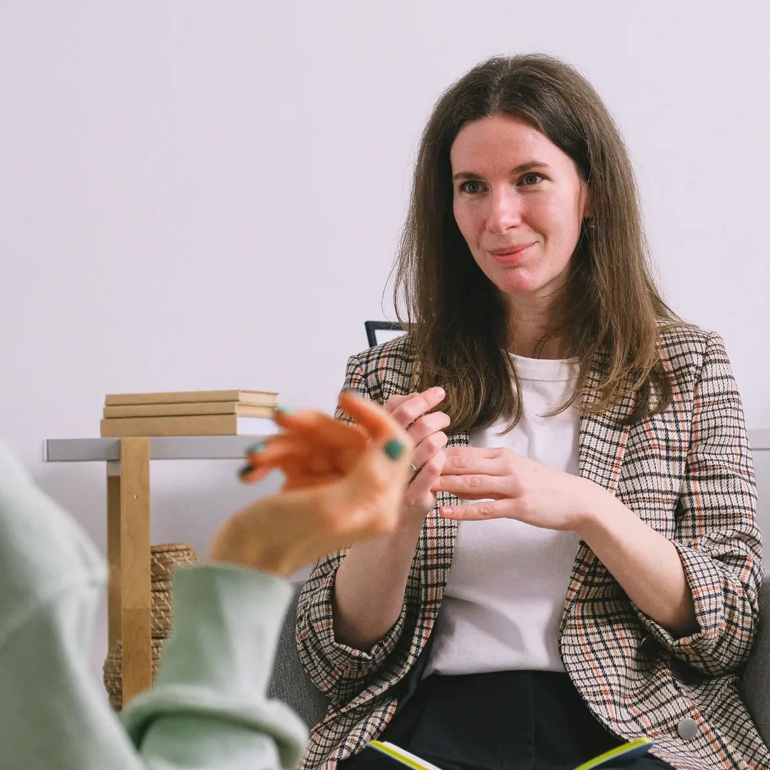 Dr Cristina Cavezza  Clinical psychologist in a therapy room at Cohesion Clinical Psychology.