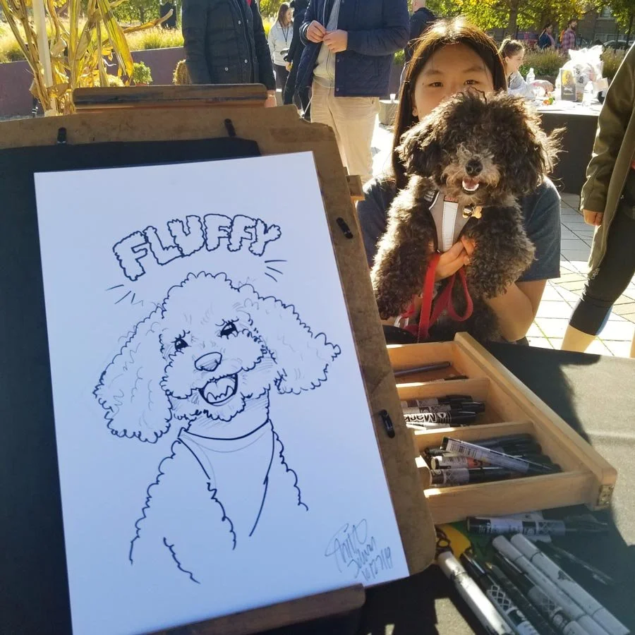 A caricature of a dog named Fluffy is on an easel with markers strewn about and a woman holds an identical smiling dog in the background.