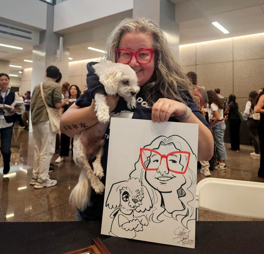 A woman with red glasses holds up her one-eyed, white dog and their caricature.