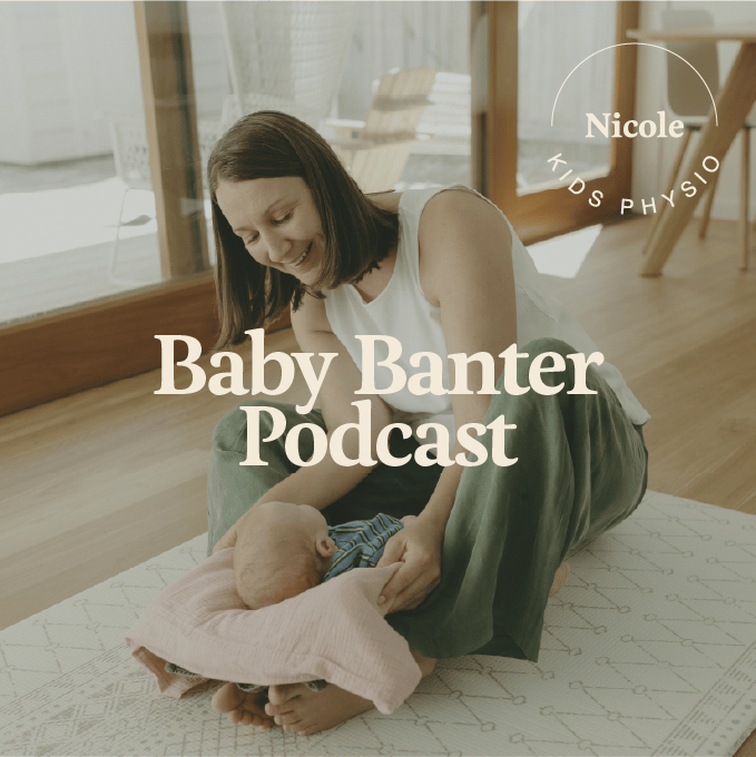 A woman smiling and engaging with a baby on a light-colored rug in a bright room with wooden floors, large windows, and natural lighting.