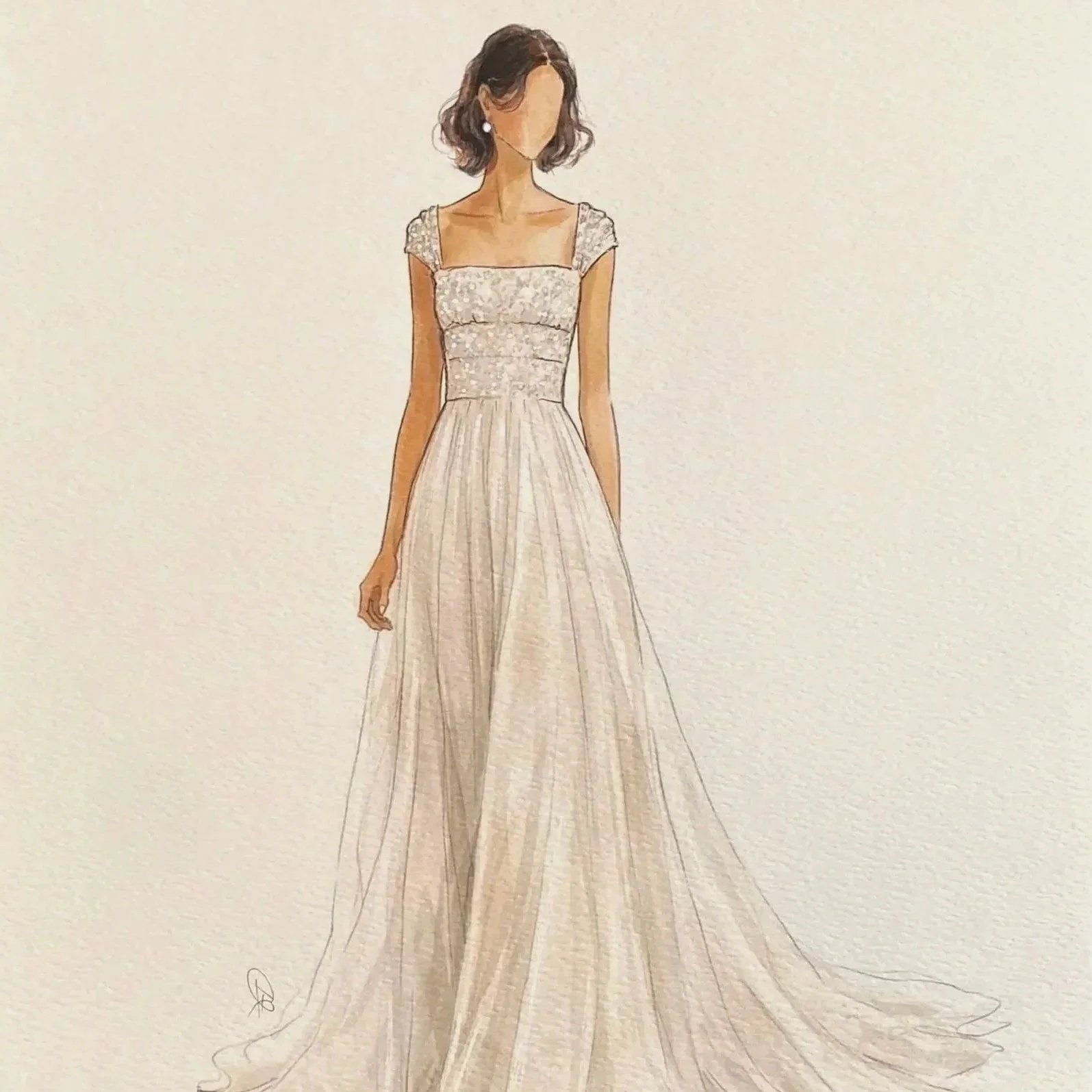 A woman wearing a long, elegant cream-colored gown with lace details on the bodice and cap sleeves, standing against a plain background.