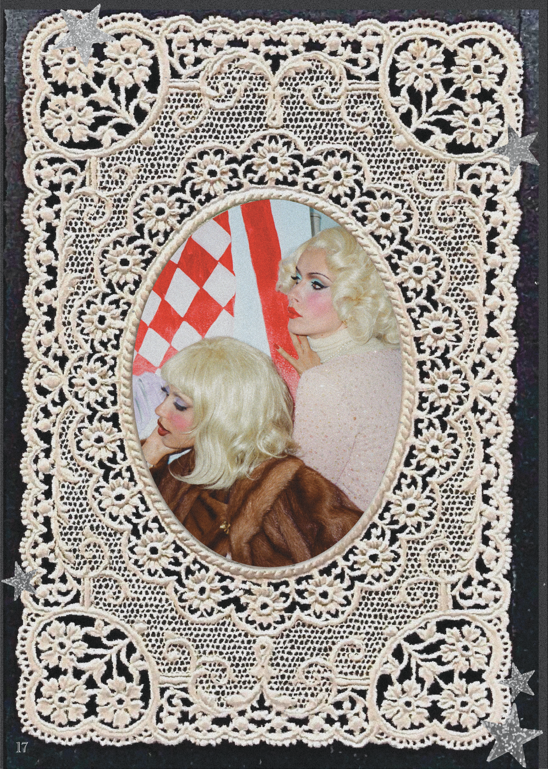 A decorative lace mirror with an oval shape, intricate floral and geometric patterns, and small star-shaped embellishments in the corners. The mirror reflects a woman with vintage-style makeup, platinum blonde hair, and a brown fur coat, and part of a red and white checkered object.