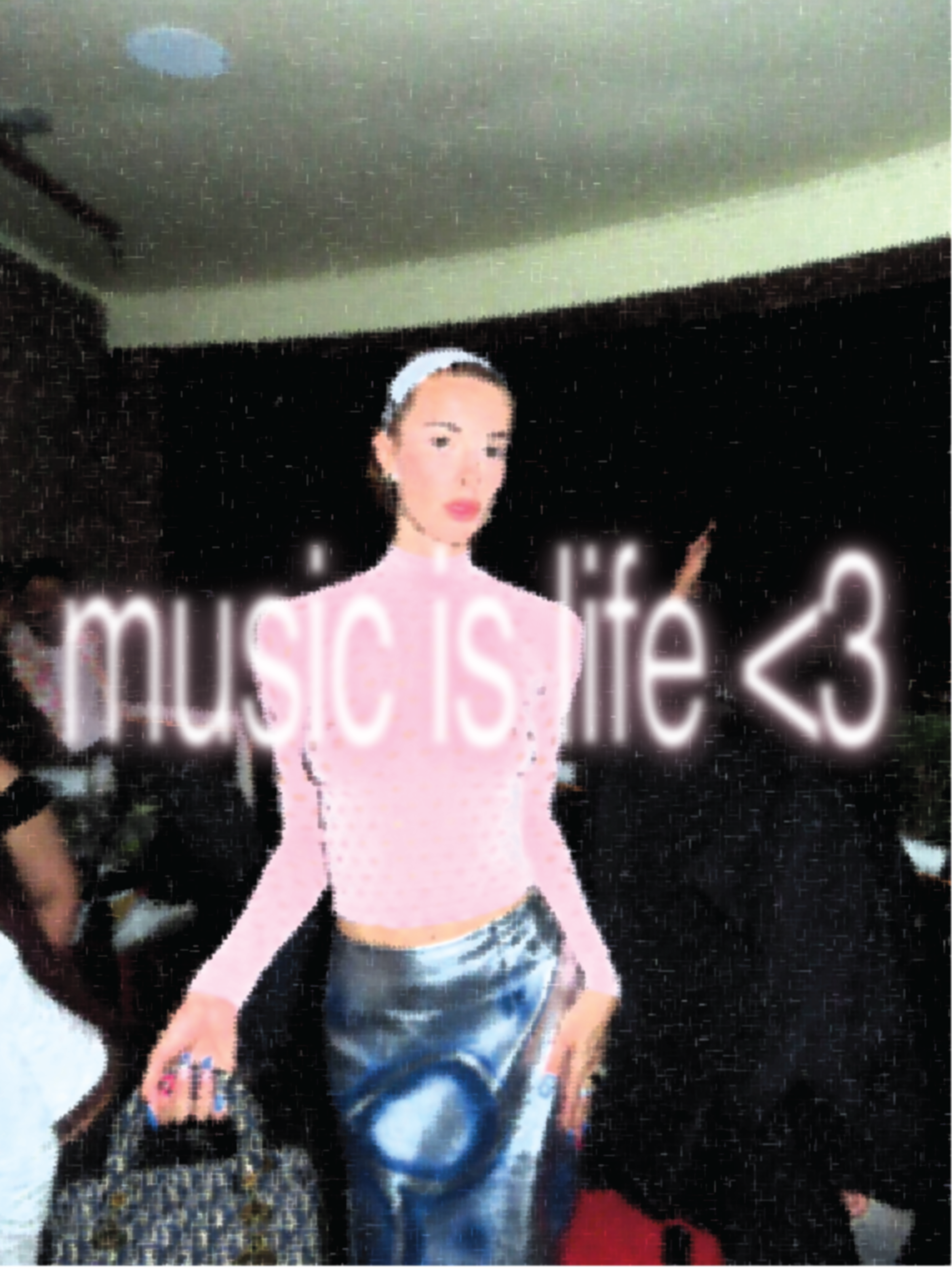 A young woman with a headband, pink shirt, and denim shorts standing with her hands on her hips in front of a dark background with illuminated text.