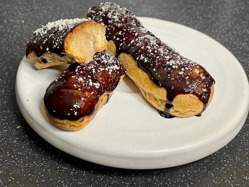 Eclairs, almonds, chocolate 🍫
.
.
.

#chouxpastry #butter #milk #water #flour #sugar #eggs #almondmousse #almonds #cr&egrave;mepatisserie #pateabombe #chocolateglaze #mirrorglaze #luscious #decadent #fingerlickinggood  #yummy #tasty #chef #bristol #