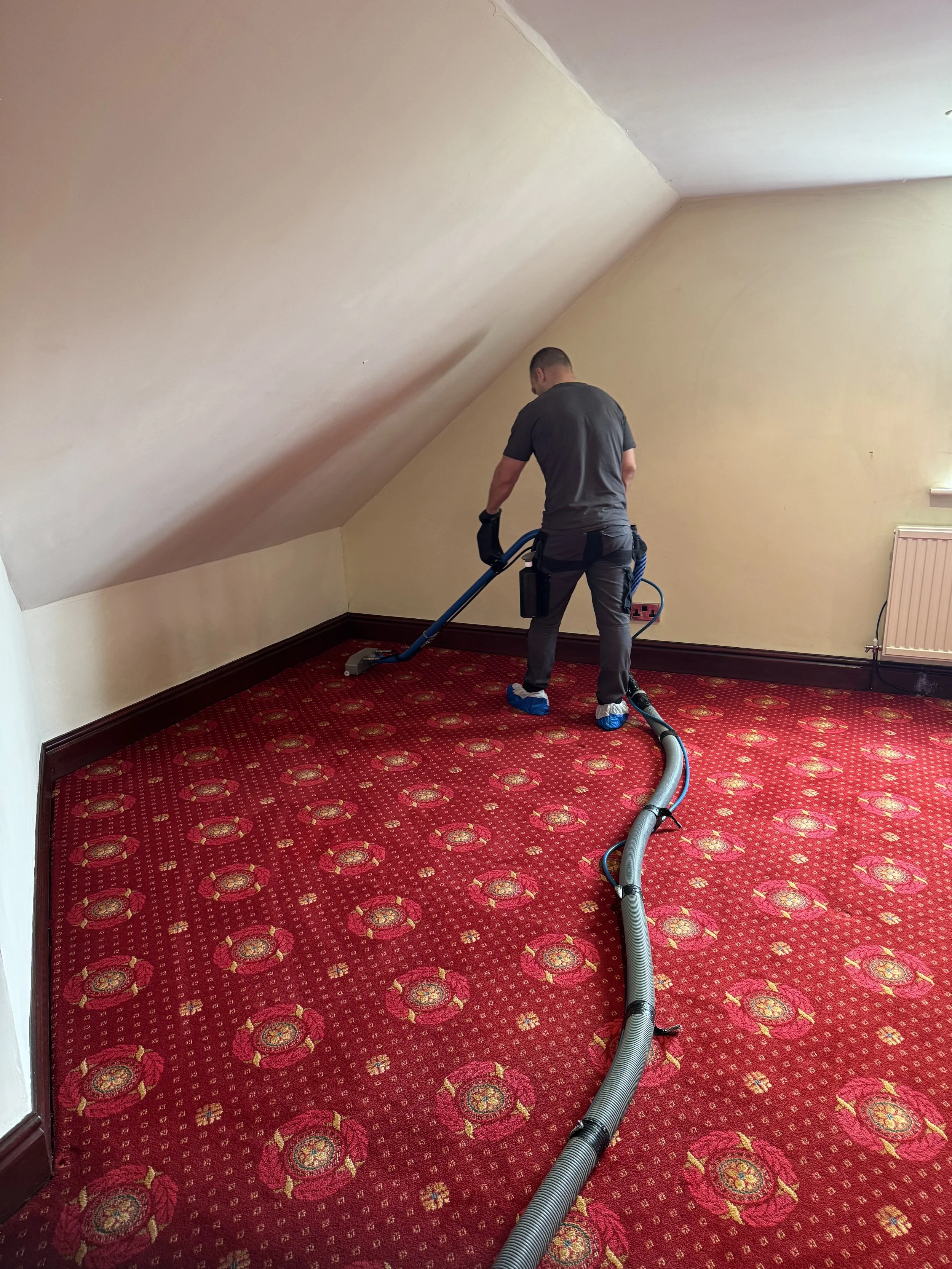 Professional carpet cleaning in Blackpool restoring a colourful patterned carpet to a fresh, vibrant finish