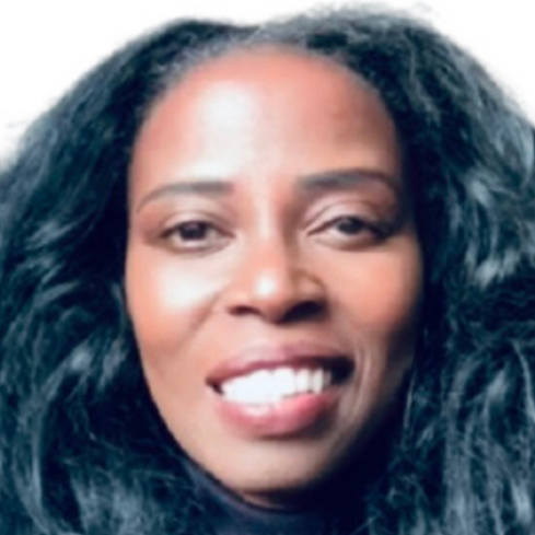 Close-up of a woman with long, wavy black hair smiling.