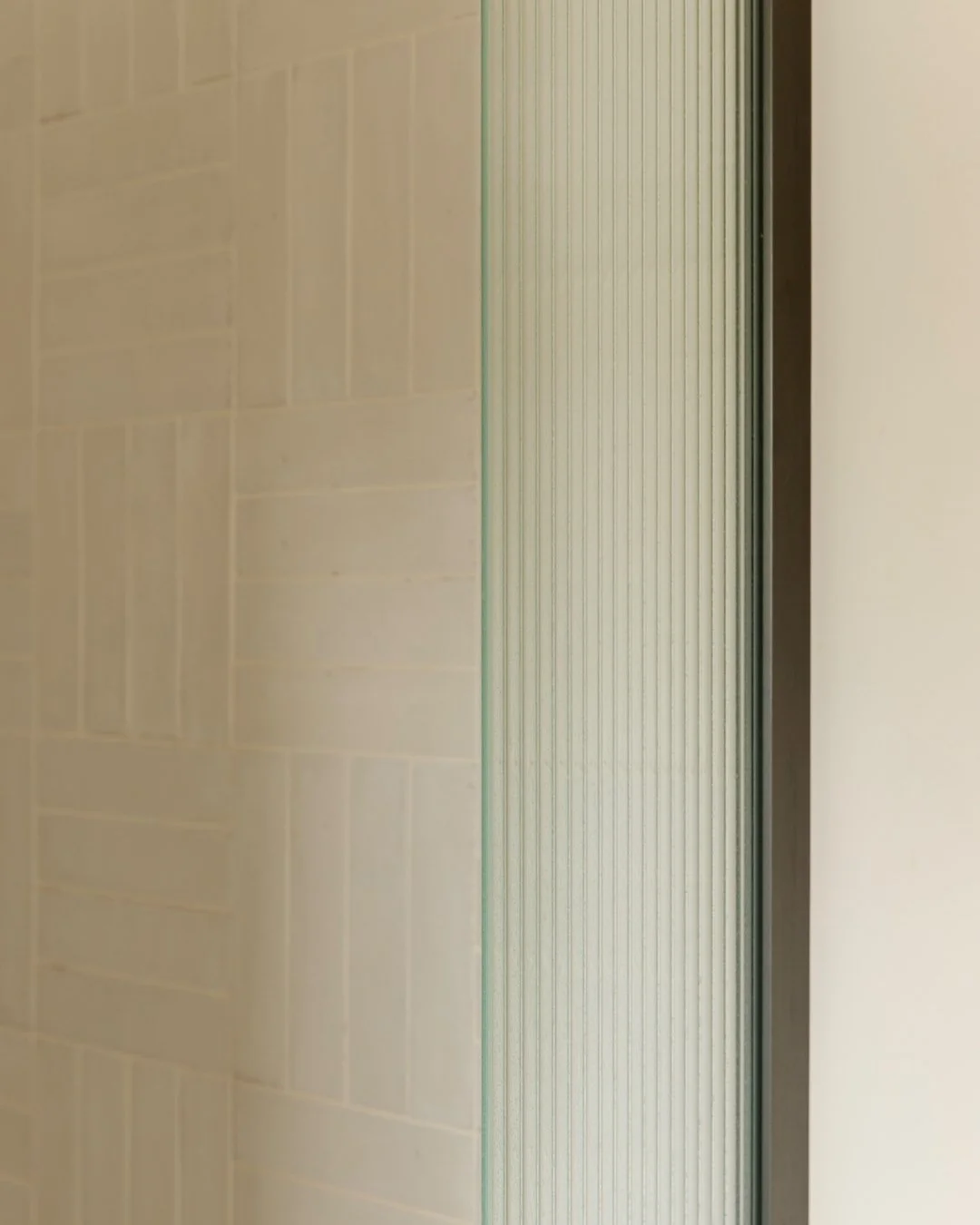 Every line, texture, and material tells a story. The interplay of light on glass and tiled surface reveals the beauty of thoughtful design. It's a reminder that the finest designs are built on the smallest, intentional details.