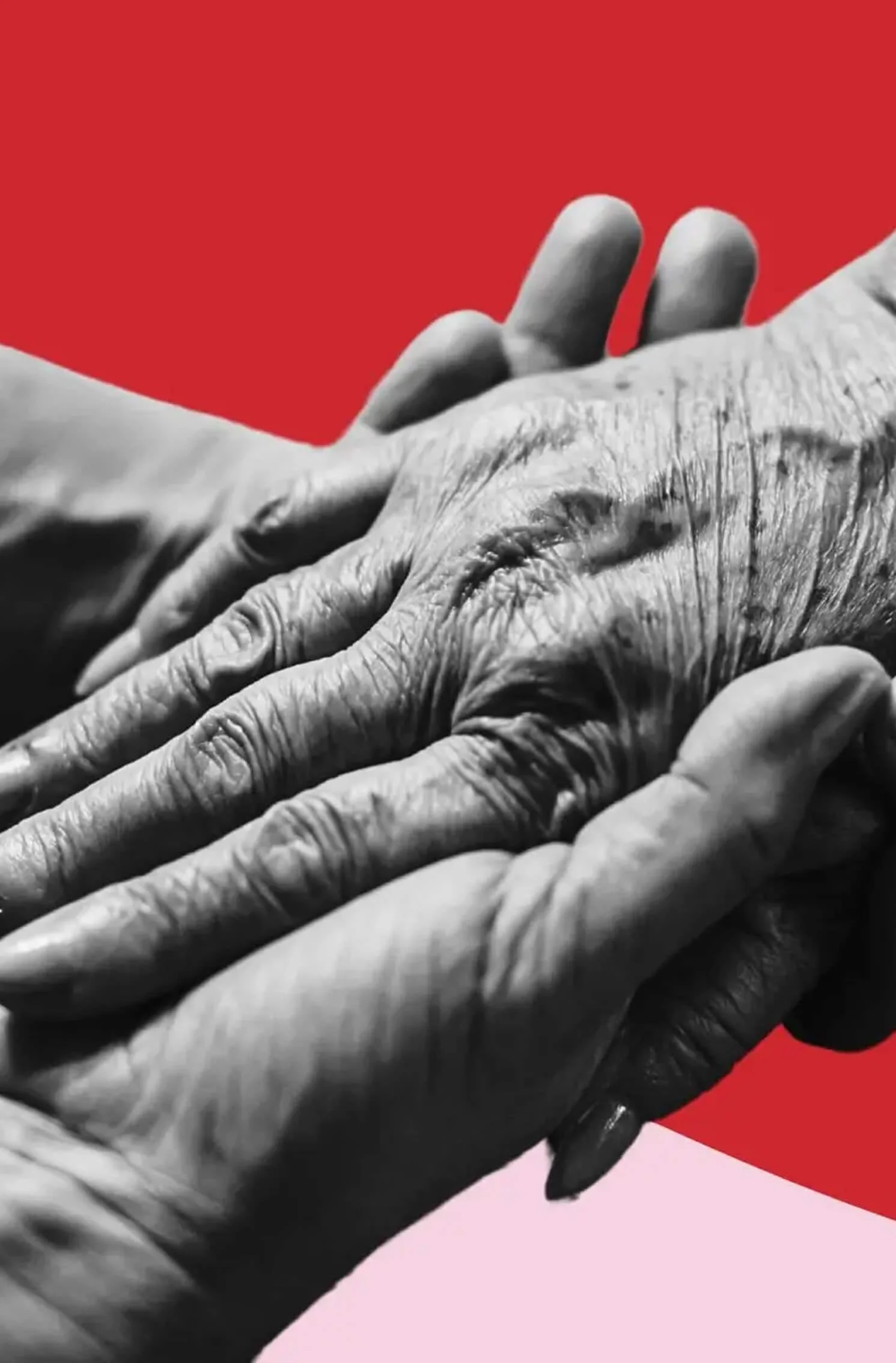 Black and white photo of two hands holding an elderly person's hand against a red and pink background.
