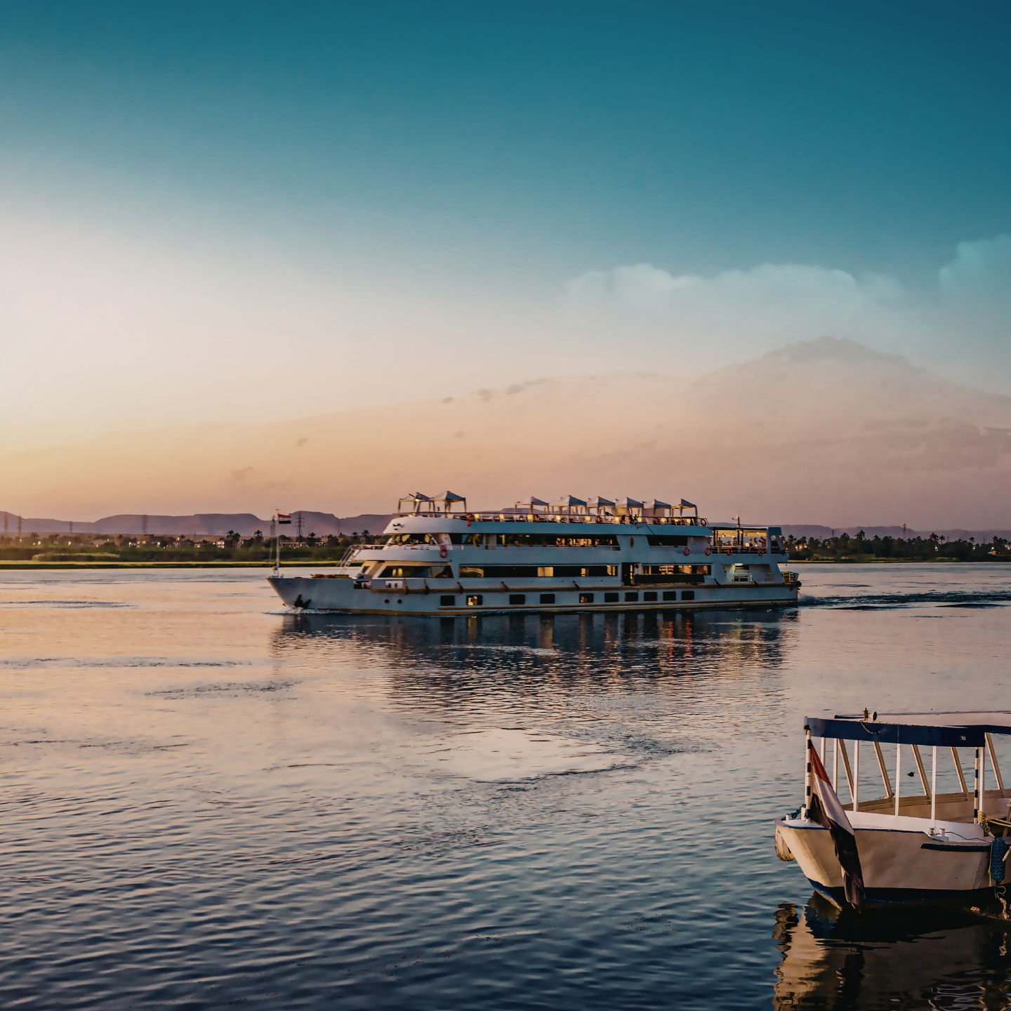 River cruise ship sailing at sunset
